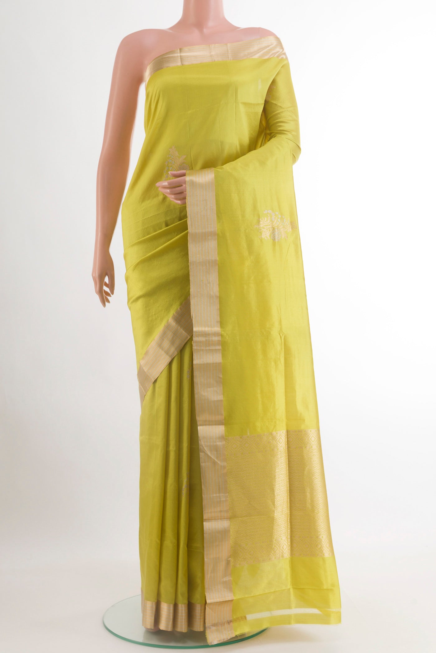 Yellow Banarasi Silk Saree with Zari Butta on the body and Zari Border.  displayed on a mannequin