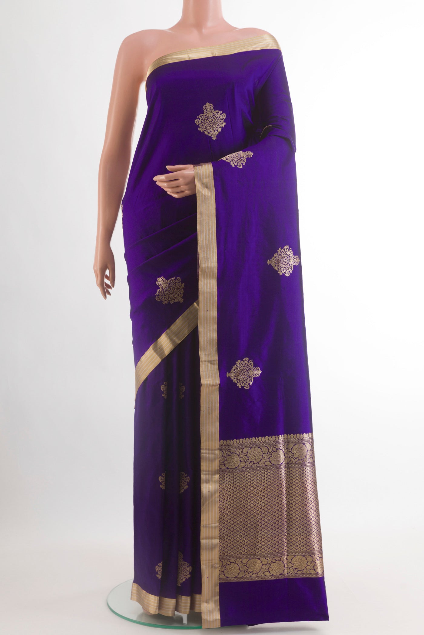 Blue Banarasi Silk Saree with Zari Butta on the body and Zari Border.  displayed on a mannequin