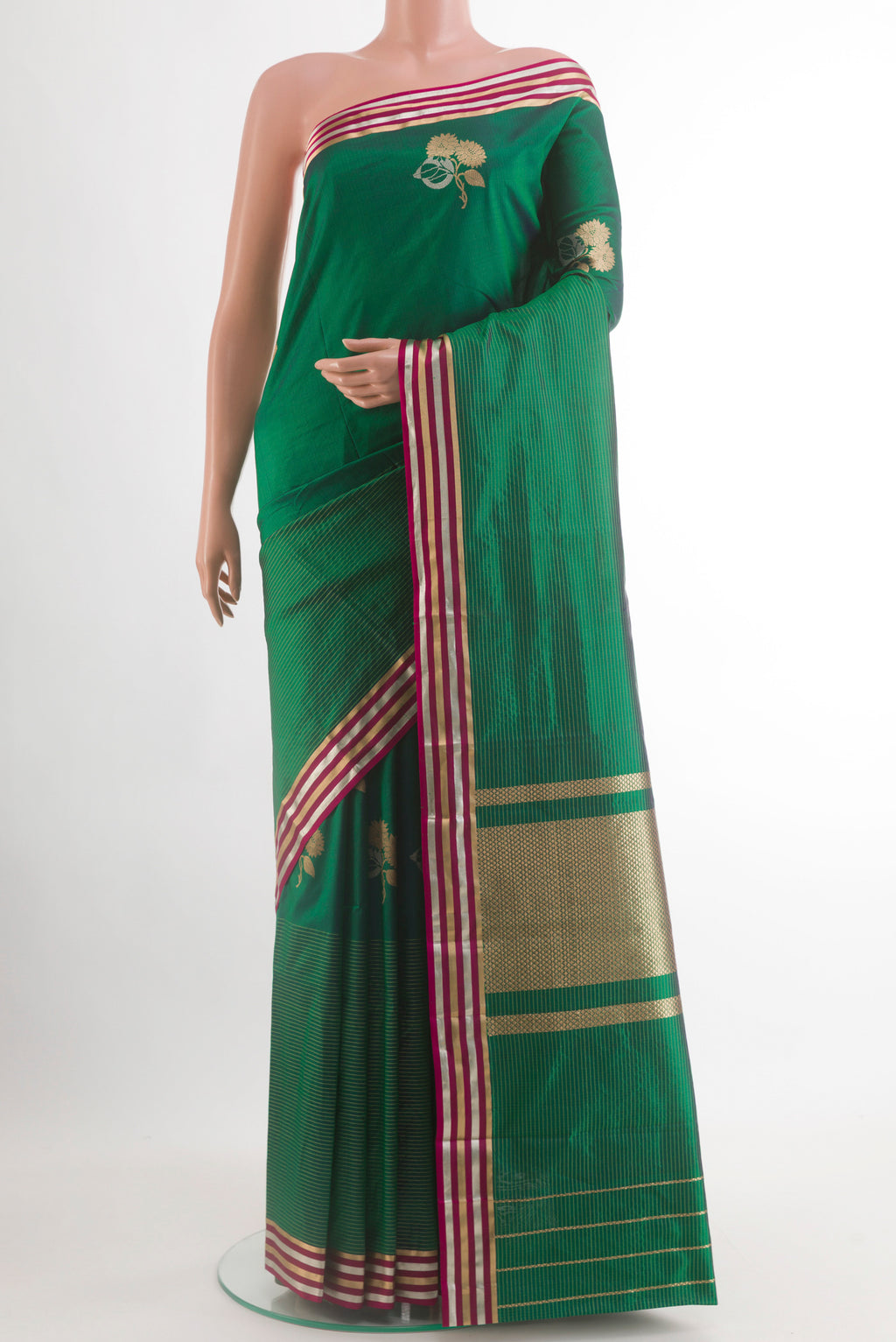 Green Banarasi Silk Saree with Zari Butta on the body and Zari Border.  displayed on a mannequin