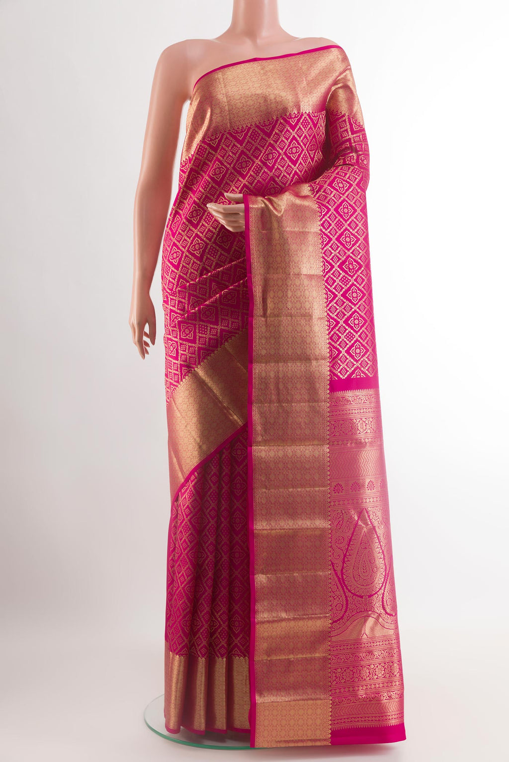 Rani Pink Kanchipuram Silk Saree with Zari Brocade on the body and Zari Border.  displayed on a mannequin