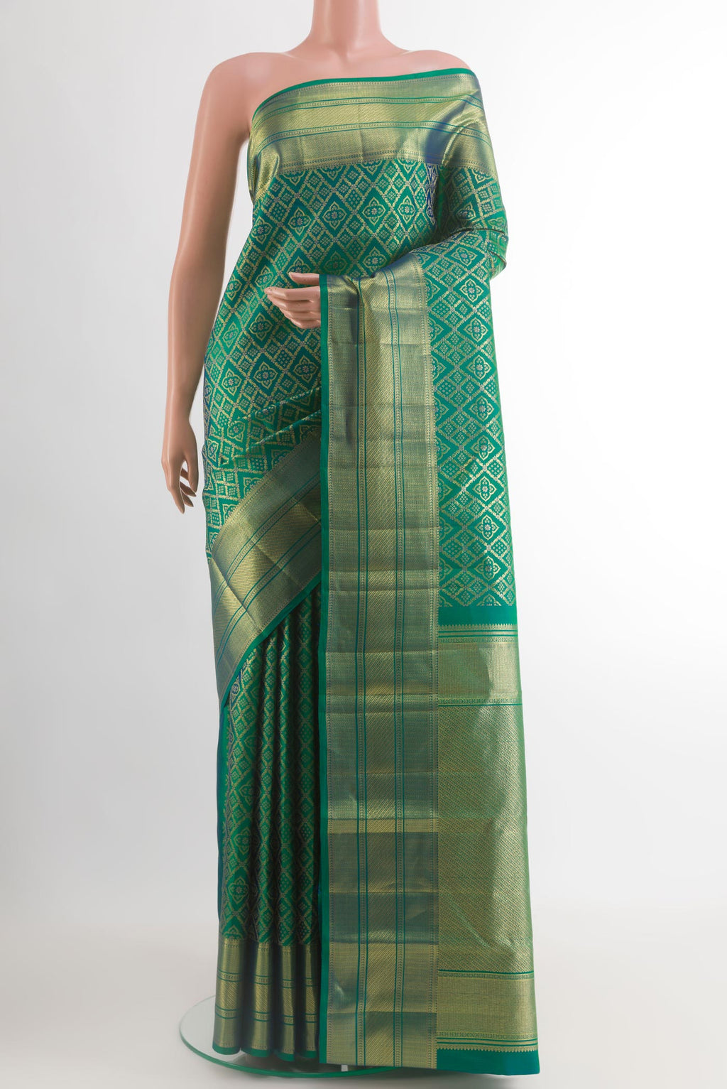 Green with Blue Color Kanchipuram Silk Saree with Zari Brocade on the body and Zari Border.  displayed on a mannequin