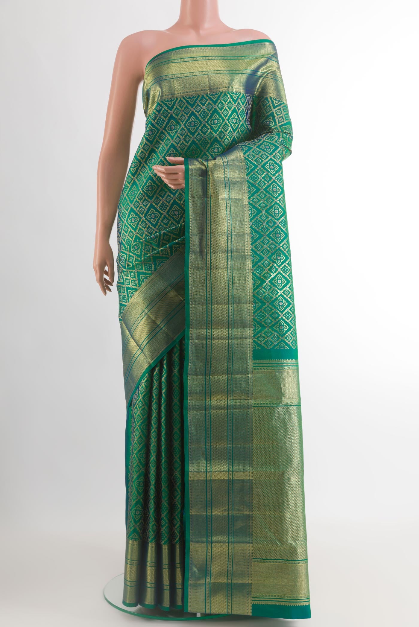 Green with Blue Color Kanchipuram Silk Saree with Zari Brocade on the body and Zari Border.  displayed on a mannequin