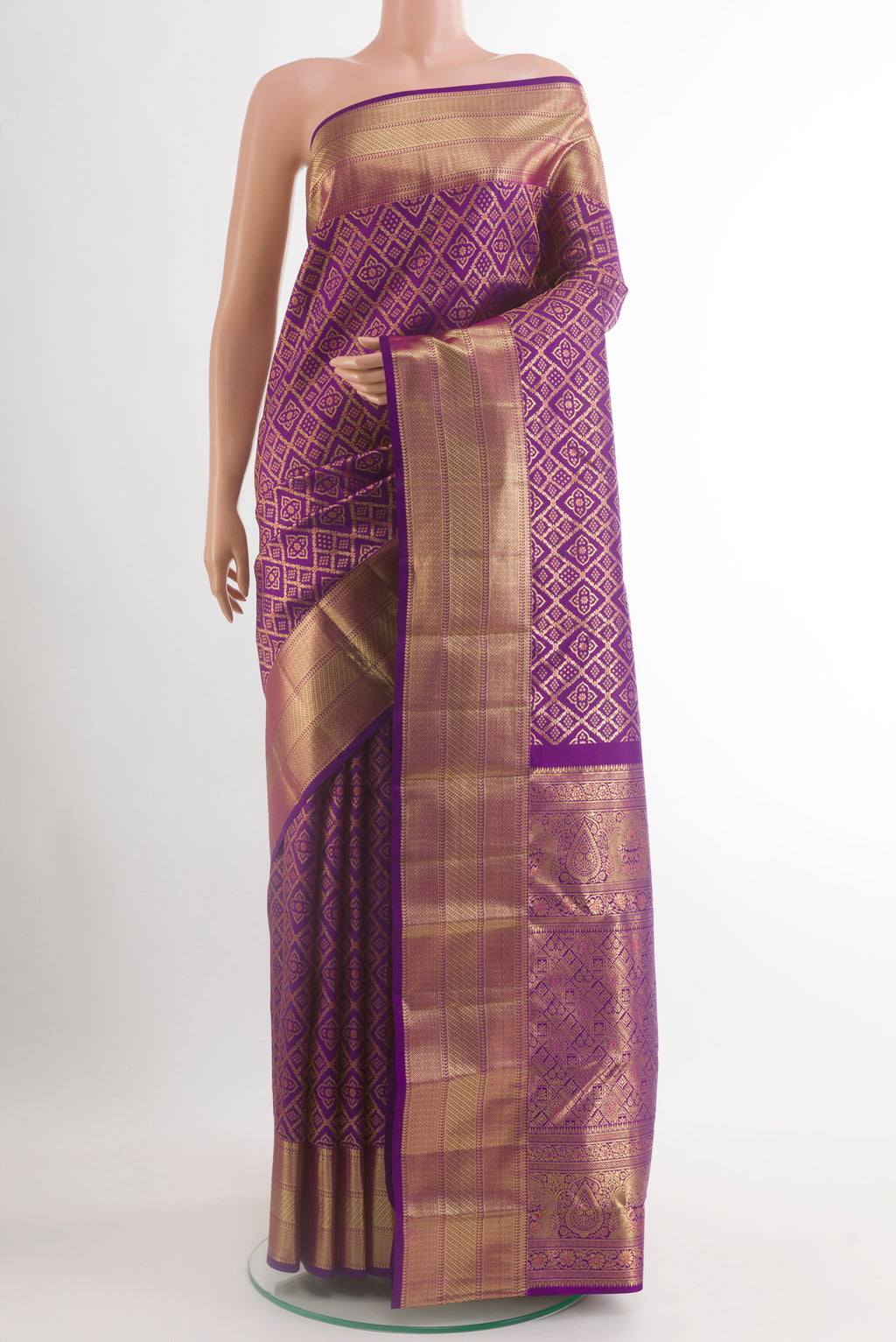 Purple Kanchipuram Silk Saree with Zari Brocade on the body and Zari Border.  displayed on a mannequin