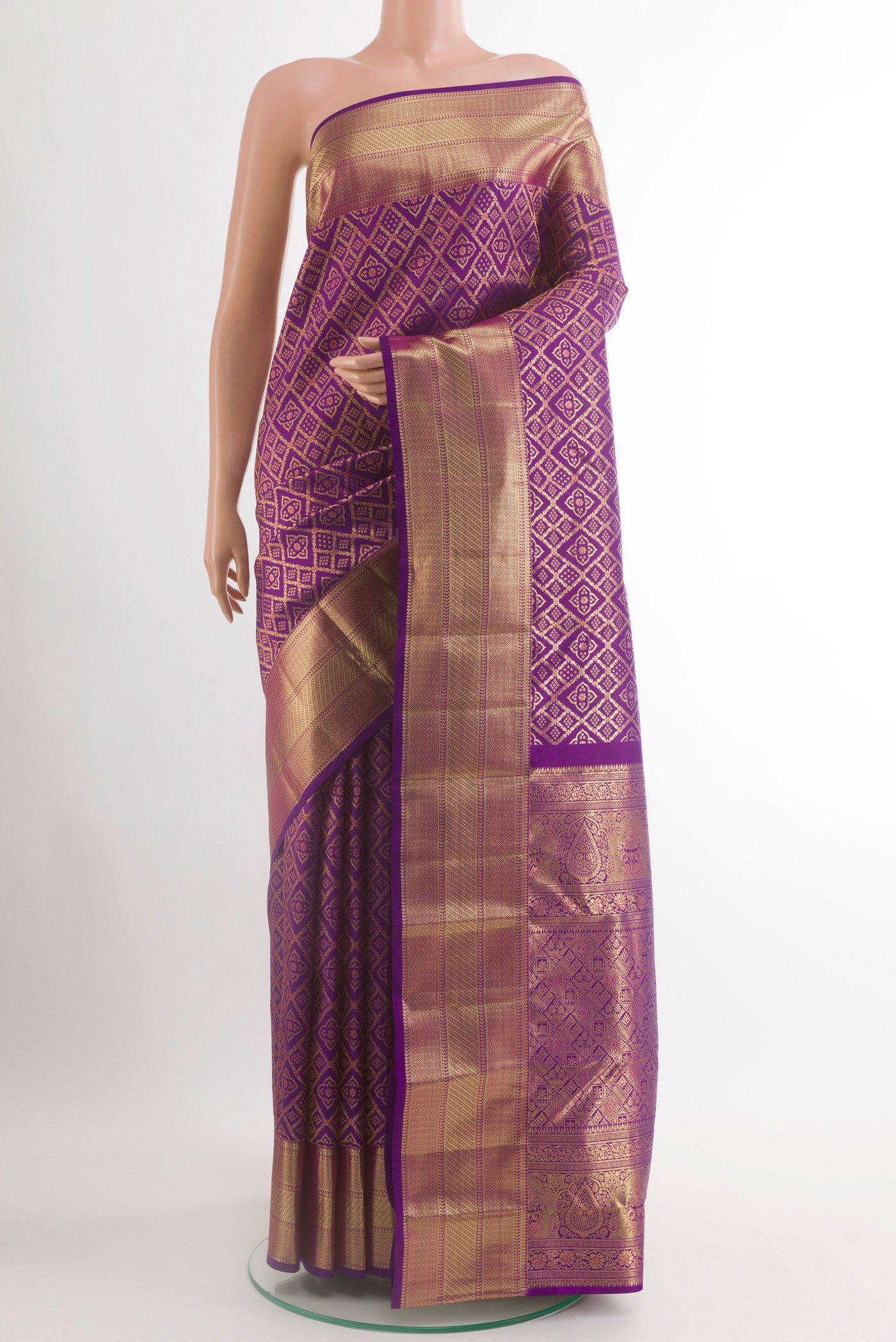 Purple Kanchipuram Silk Saree with Zari Brocade on the body and Zari Border.  displayed on a mannequin