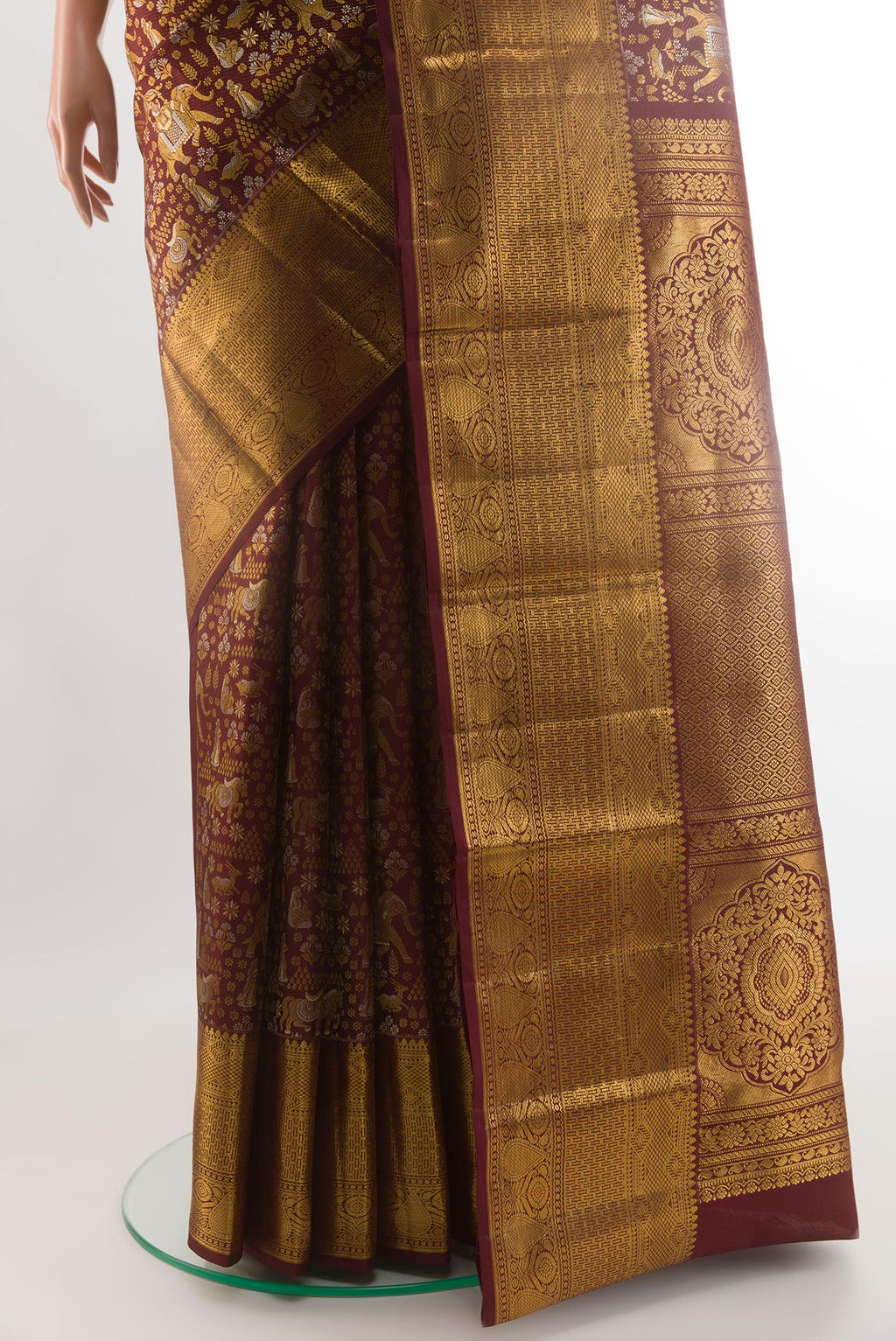 Pleats and pallu of Brown Kanjivaram Silk Saree with Zari Brocade on the body and Zari Border. 