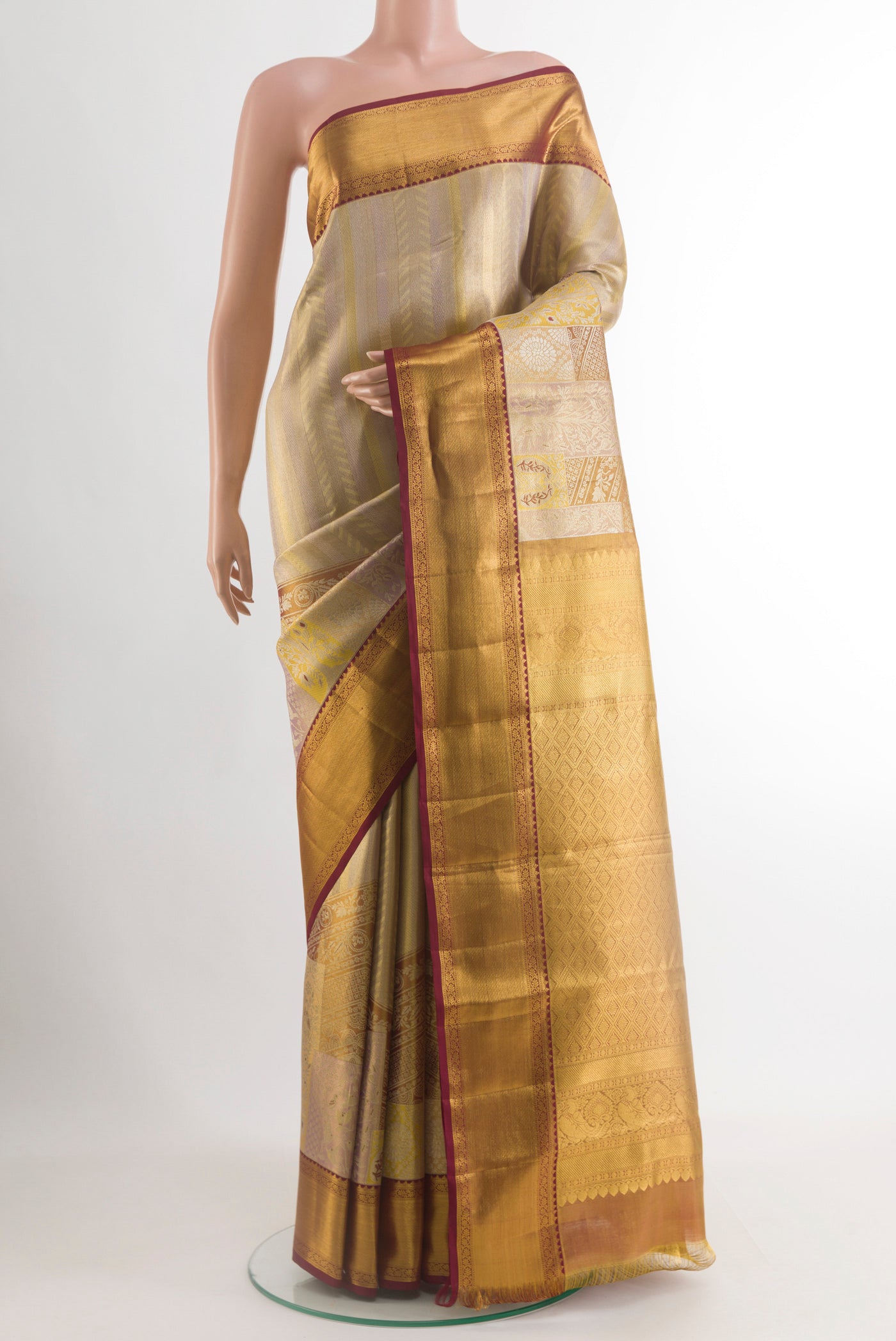 Grey Kanchipuram Tissue Silk Saree with Zari Brocade on the body and Zari Border.  displayed on a mannequin