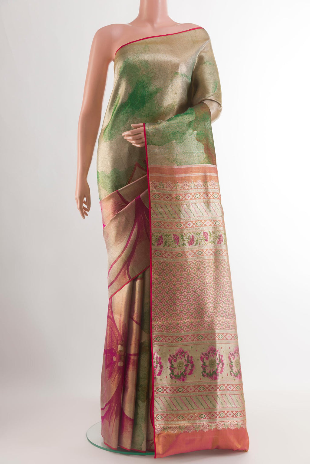 Green Kanjivaram Tissue Silk Saree with Zari Brocade on the body and Zari Border.  displayed on a mannequin
