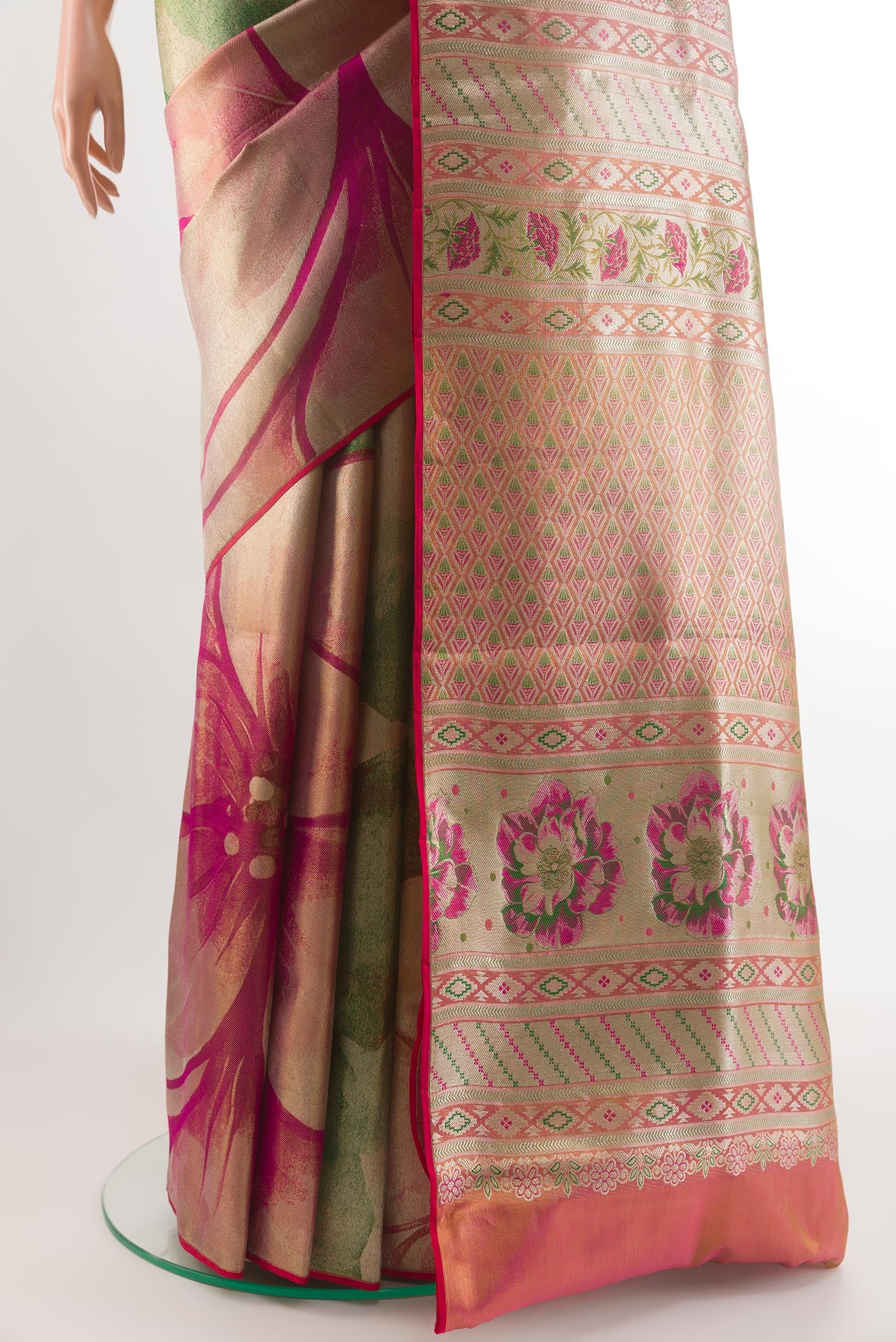Pleats and pallu of Green Kanjivaram Tissue Silk Saree with Zari Brocade on the body and Zari Border. 