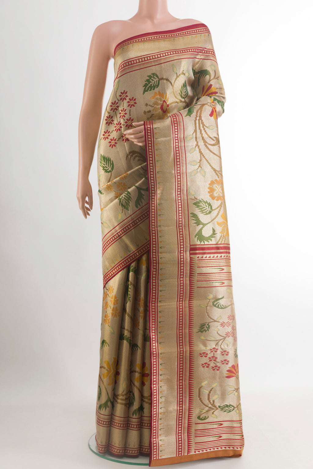 Golden Kanjivaram Tissue Silk Saree with Zari Brocade on the body and Zari Border.  displayed on a mannequin