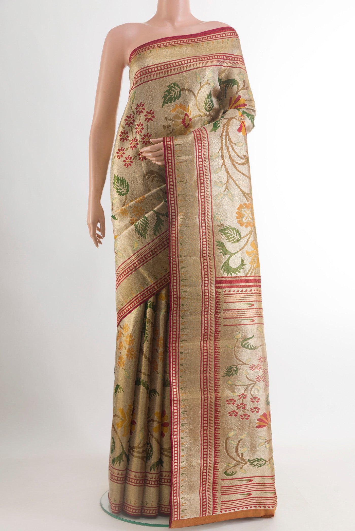 Golden Kanjivaram Tissue Silk Saree with Zari Brocade on the body and Zari Border.  displayed on a mannequin