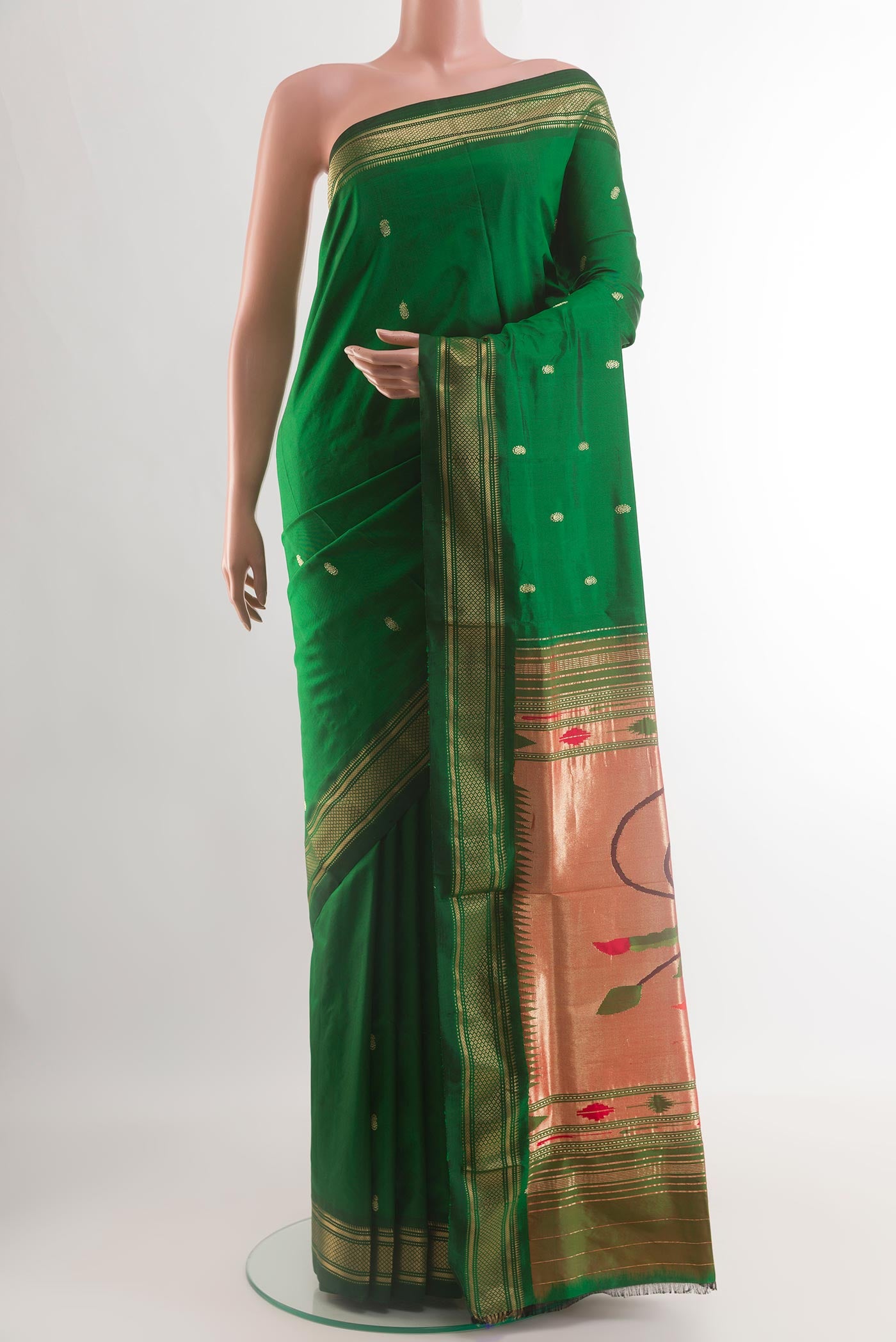 Green Paithani Silk Saree with Zari Butta on the body and Zari Border.  displayed on a mannequin