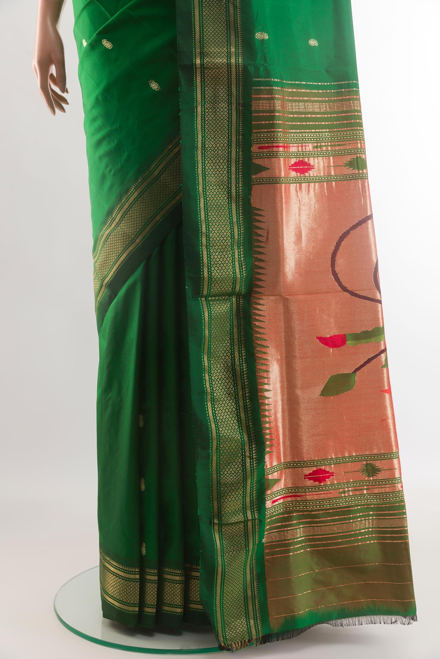 Pleats and pallu of Green Paithani Silk Saree with Zari Butta on the body and Zari Border. 