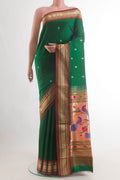 Pure Silk Green Paithani Saree with Zari Butta on the body and Zari Border.  displayed on a mannequin