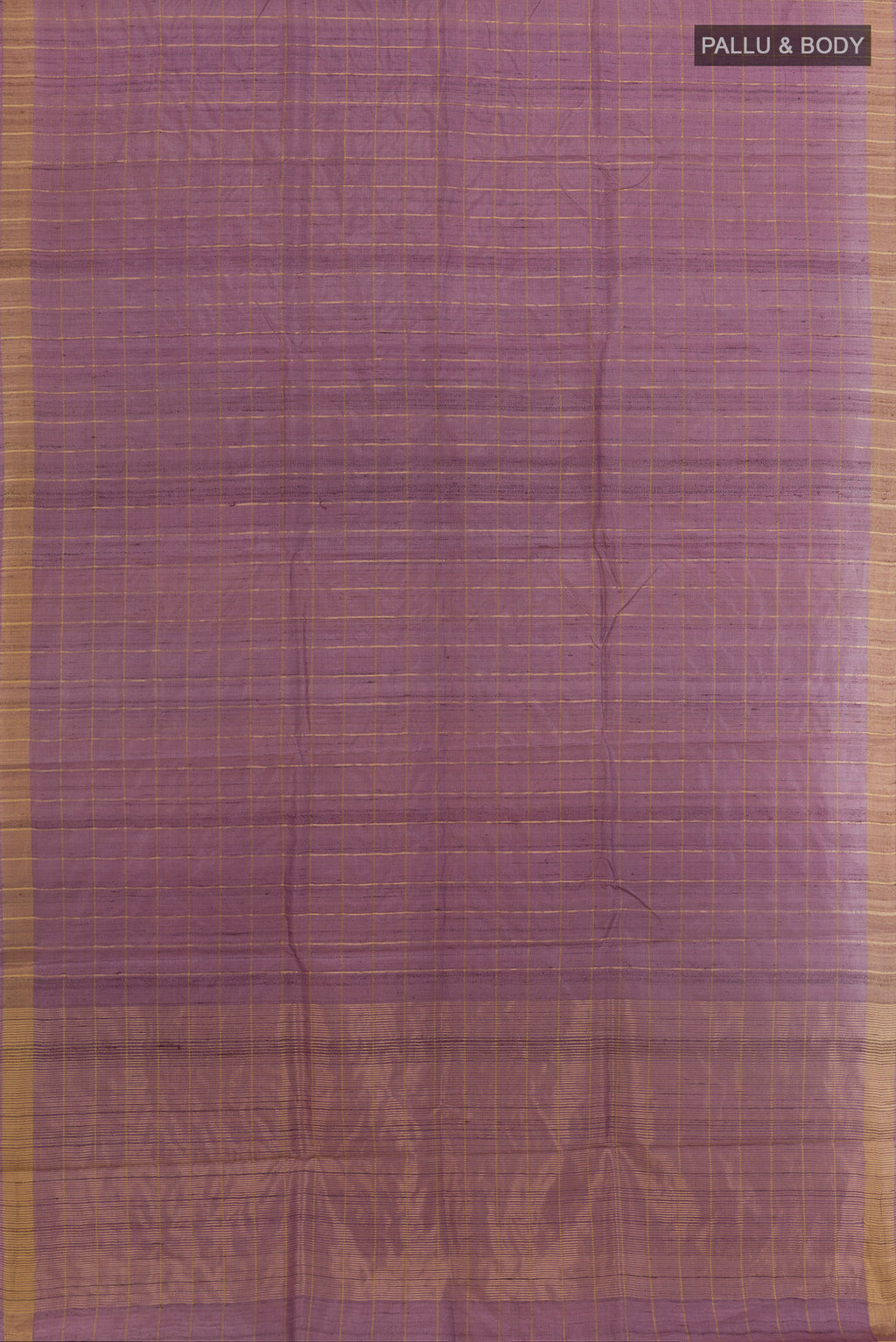 Flat view of Lavender Tussar Silk Saree with Checked design on the body and Zari Border. 