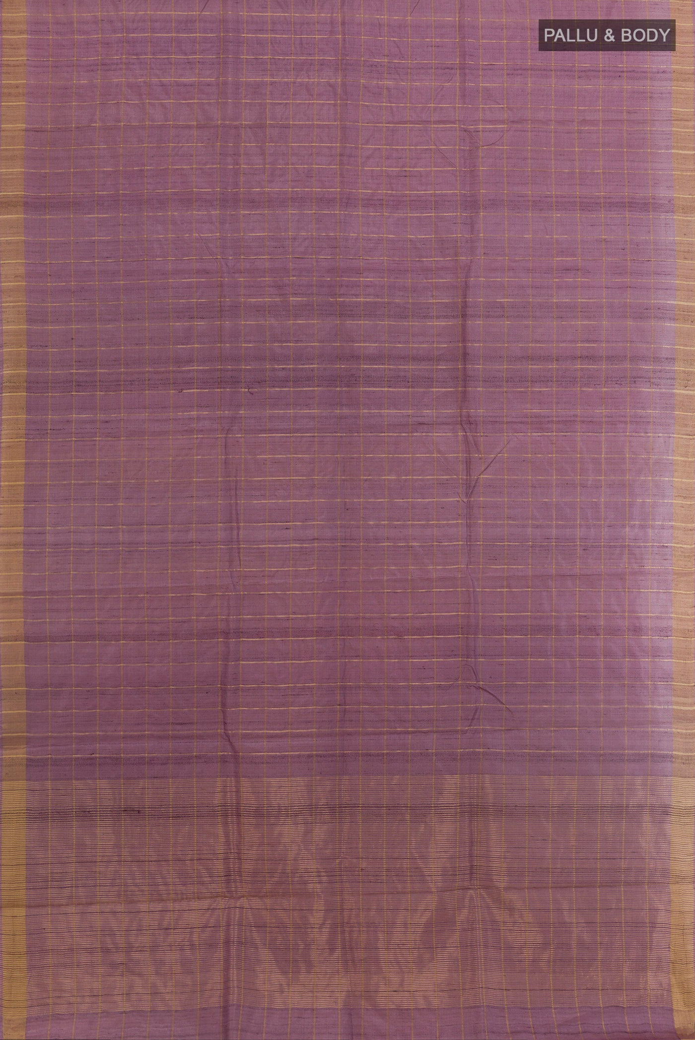 Flat view of Lavender Tussar Silk Saree with Checked design on the body and Zari Border. 