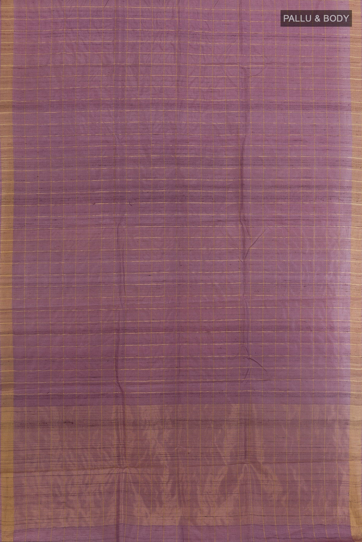 Flat view of Lavender Tussar Silk Saree with Checked design on the body and Zari Border. 