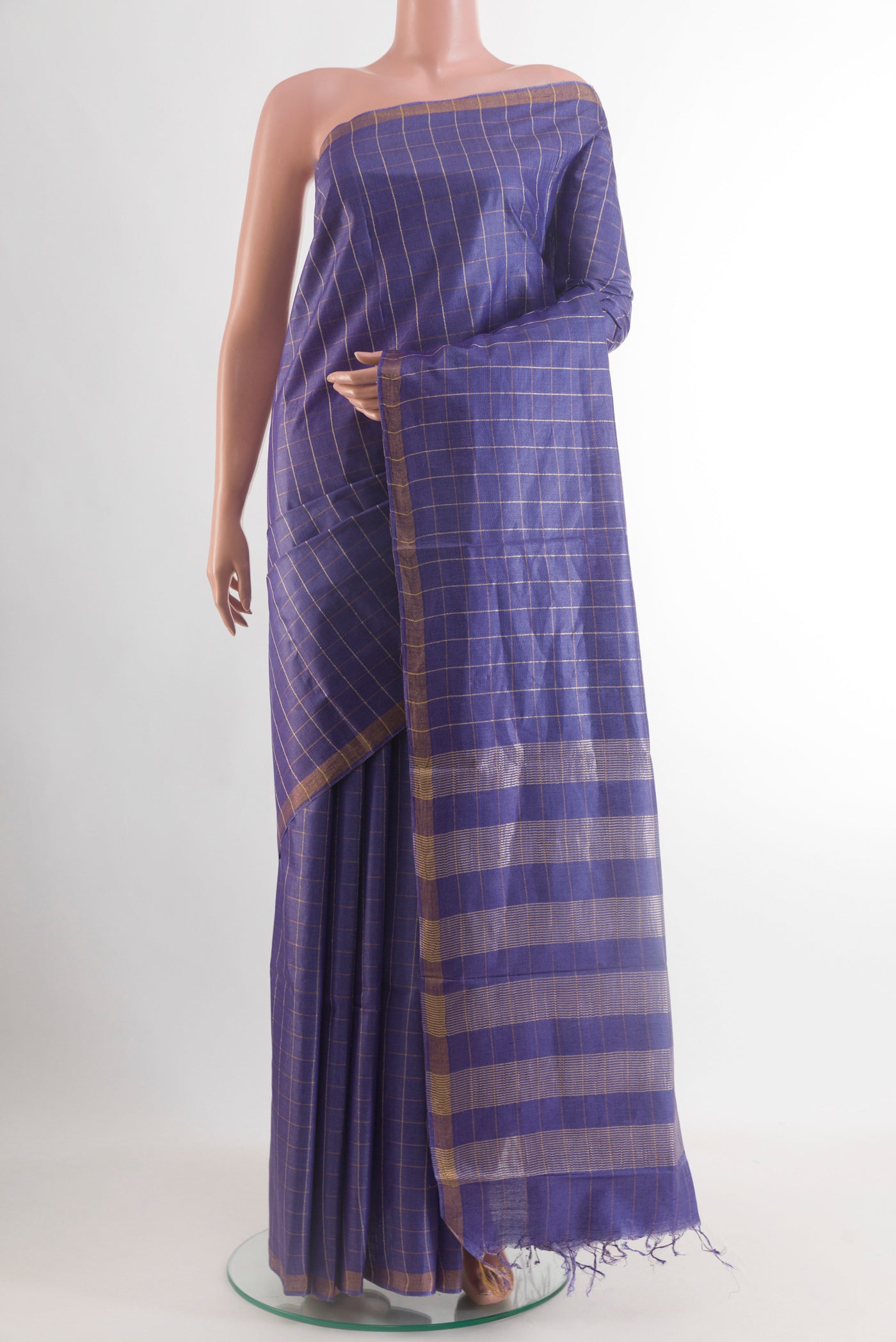 Blue Tussar Saree with Checked design on the body and Zari Border.  displayed on a mannequin