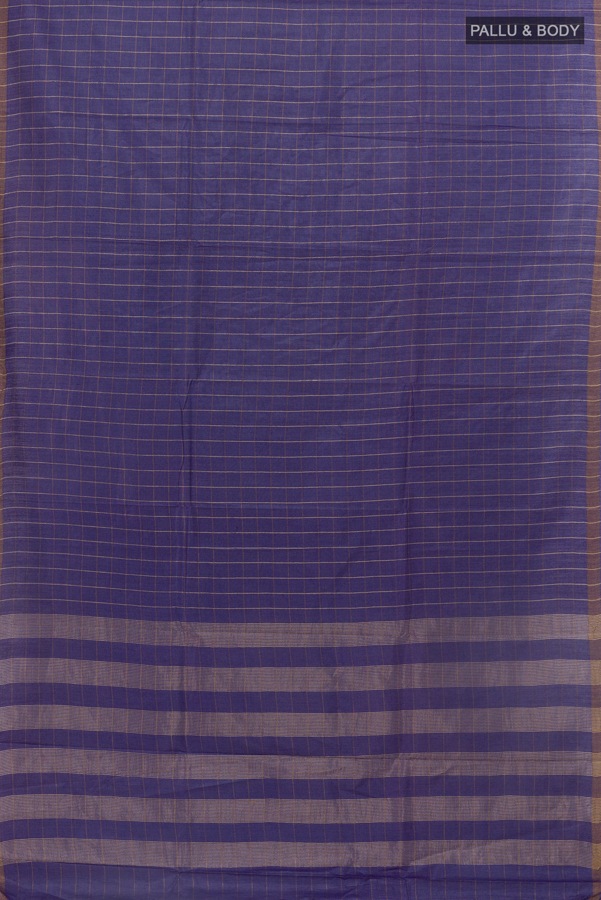 Flat view of Blue Tussar Saree with Checked design on the body and Zari Border. 