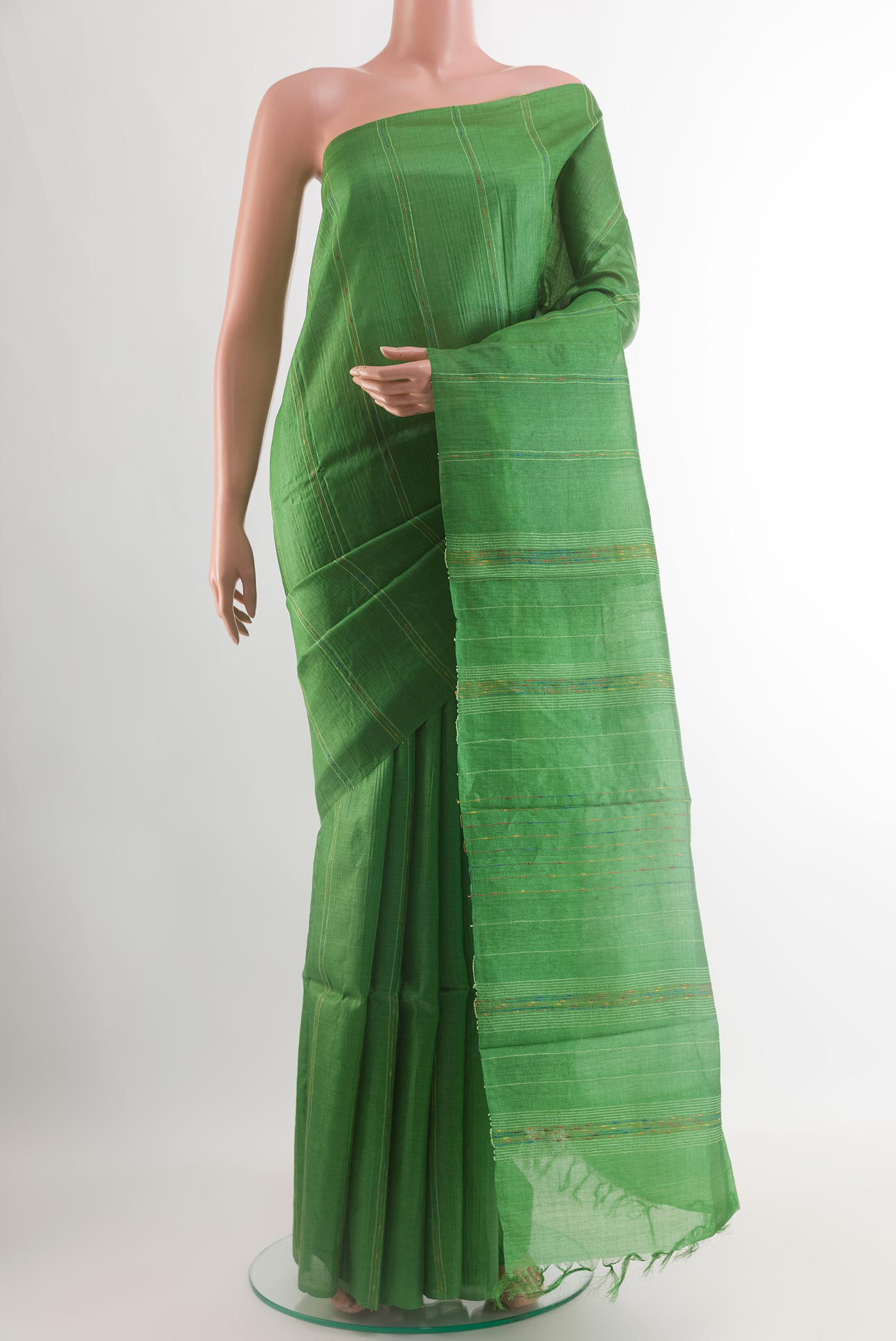 Green Tussar Silk Saree with Stripes on the body and Without Border.  displayed on a mannequin
