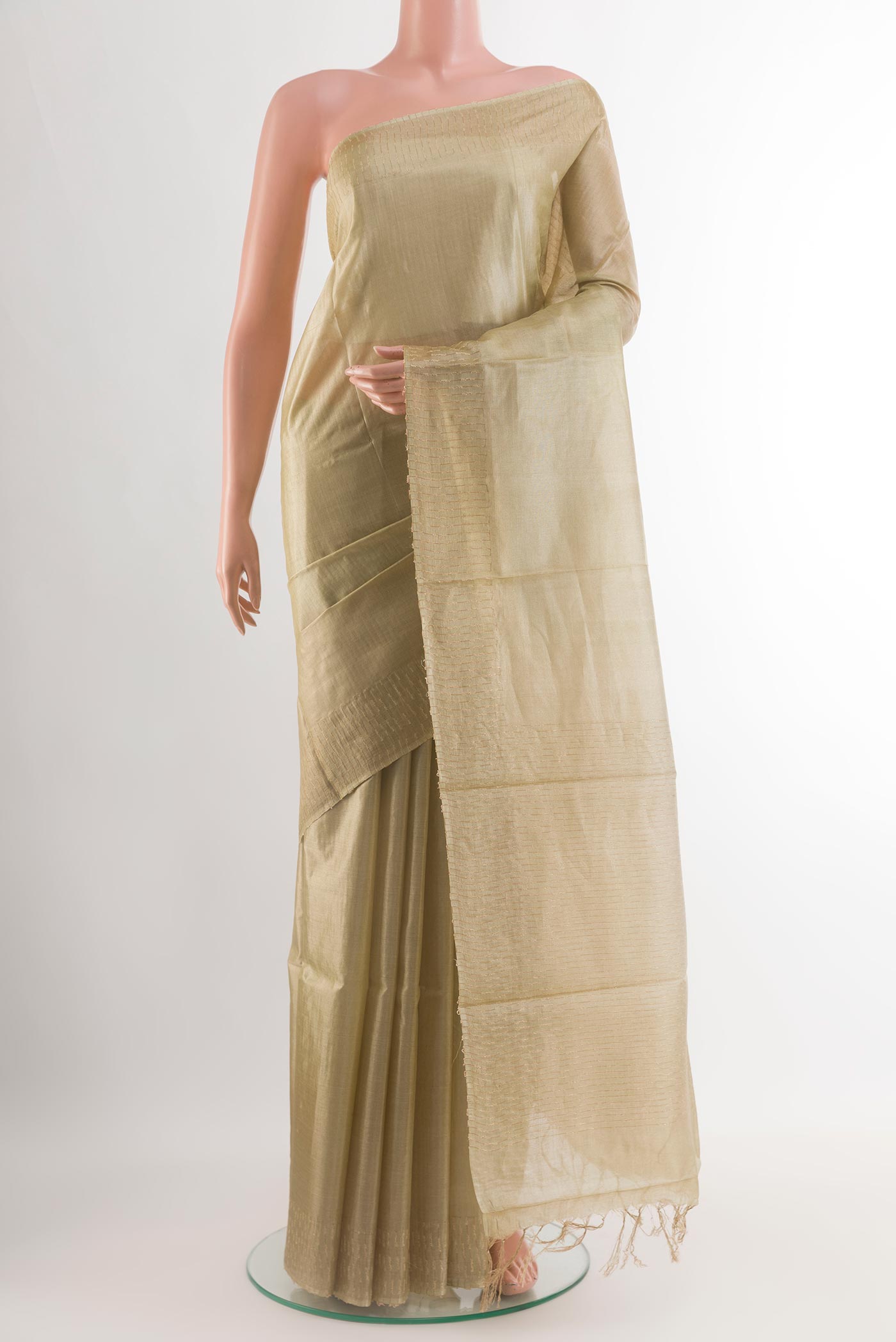 Beige Tussar Silk Saree with Plain Body and Zari Border.  displayed on a mannequin