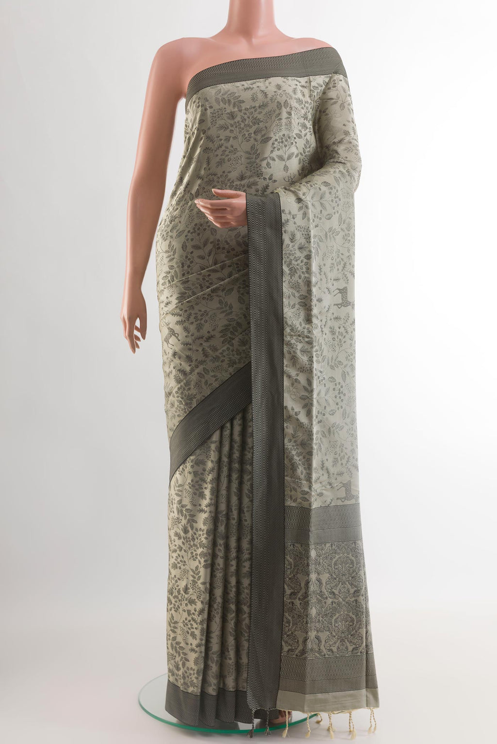 Grey Soft Silk Saree with Jacquard design on the body and Thread Border.  displayed on a mannequin