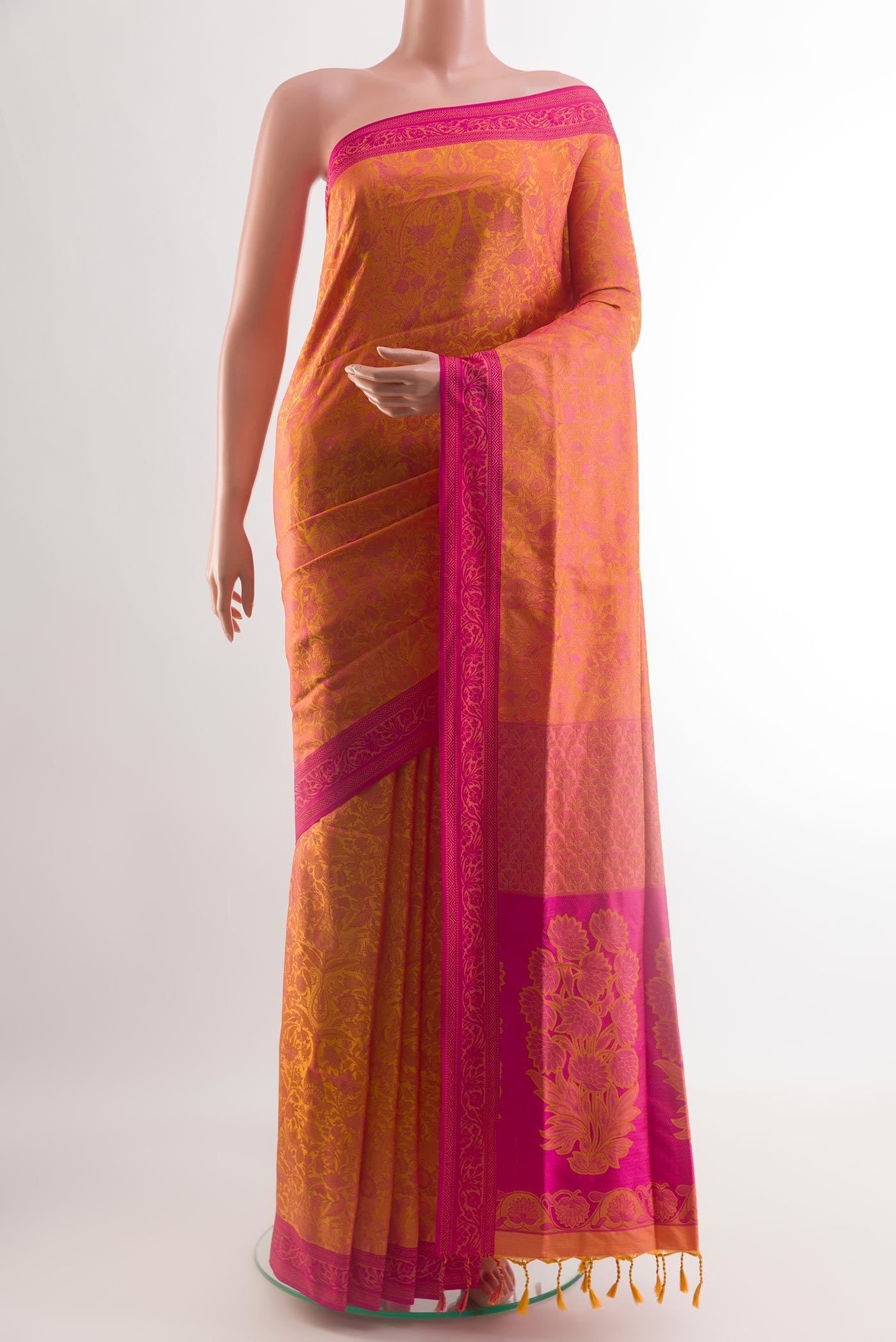 Yellow Soft Silk Saree with Jacquard design on the body and Embroidery Border.  displayed on a mannequin