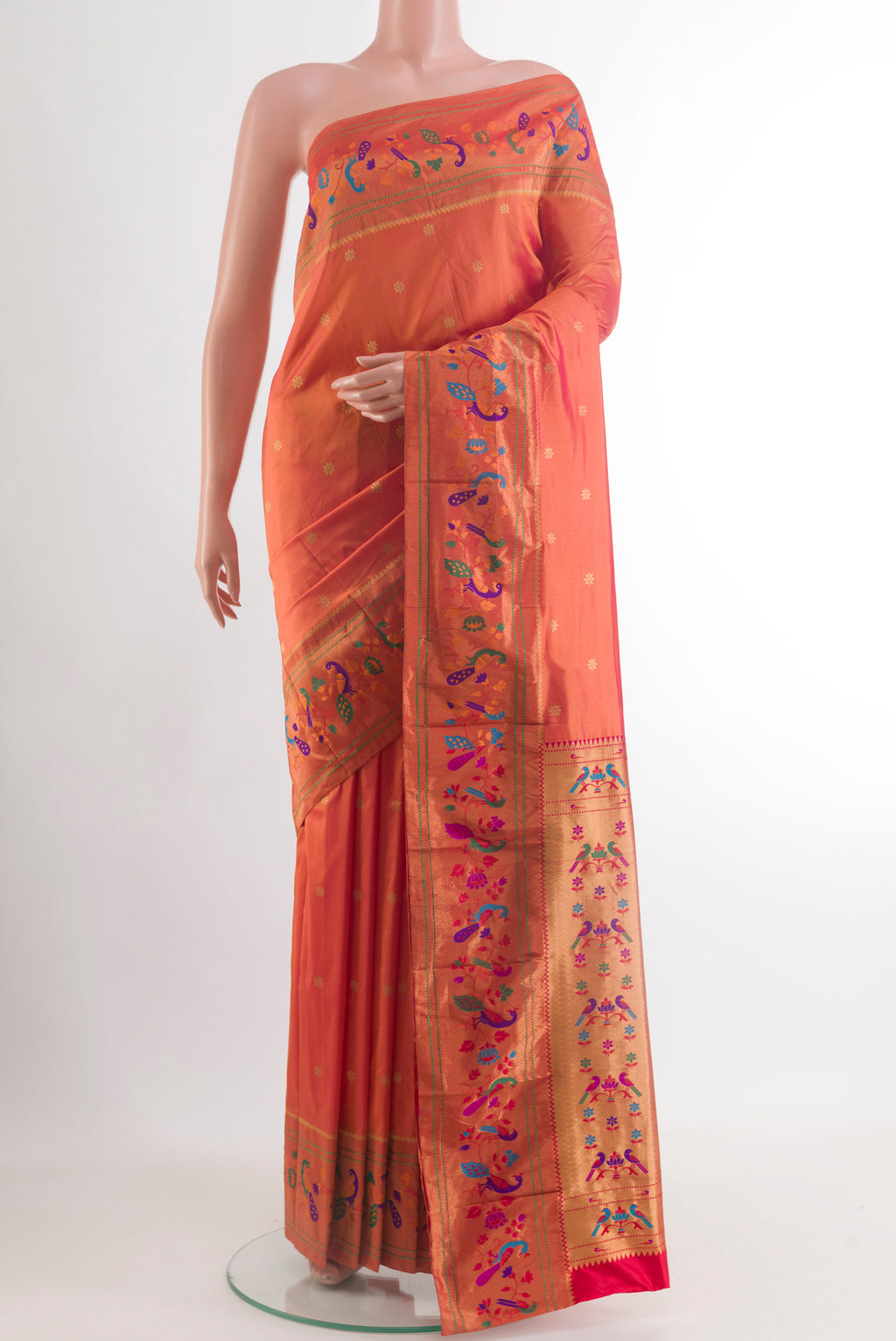 Brick Orange Gadwal Silk Saree with Zari Butta on the body and Paithani Border.  displayed on a mannequin
