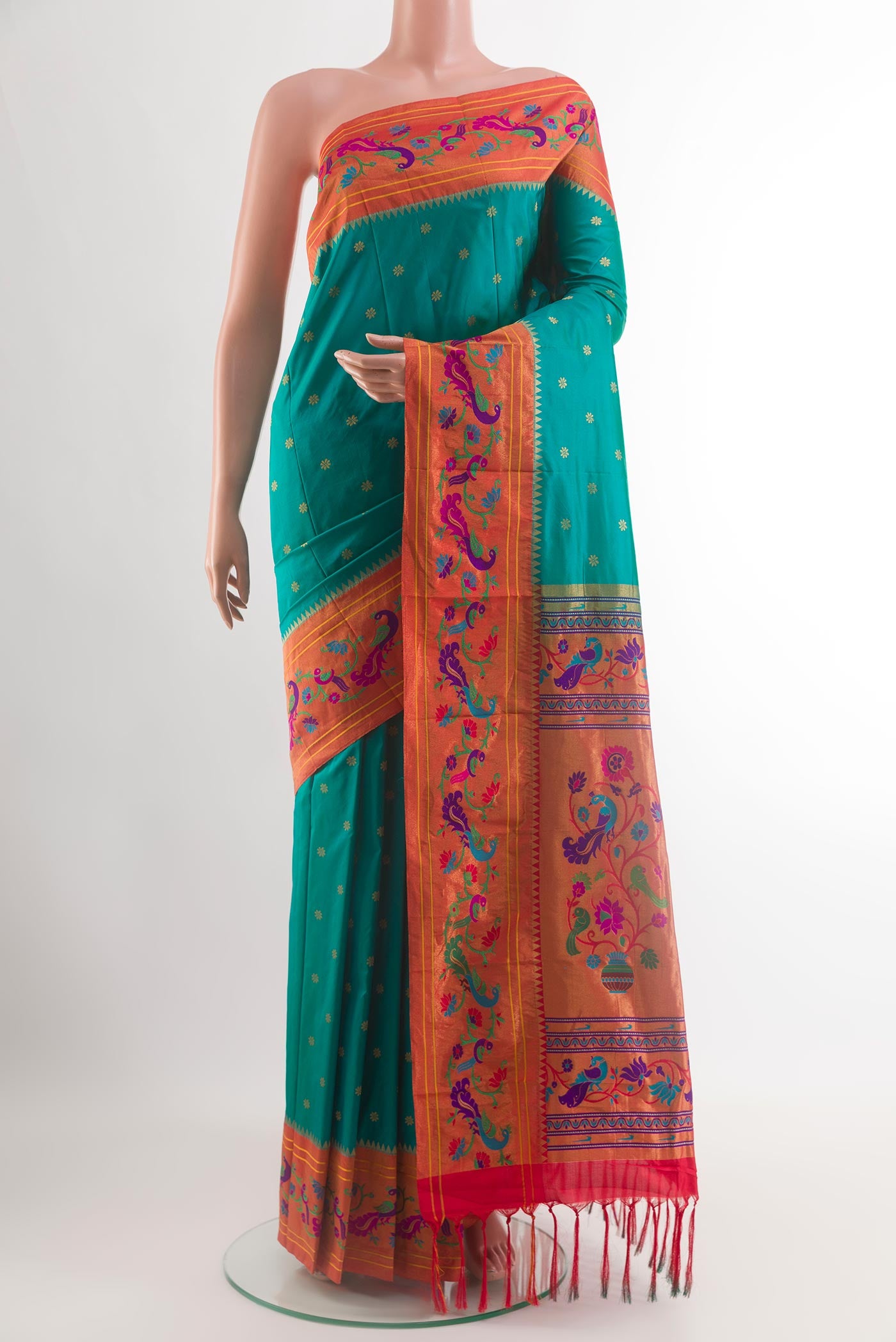 Peacock Blue Gadwal Silk Saree with Zari Butta on the body and Paithani Border.  displayed on a mannequin