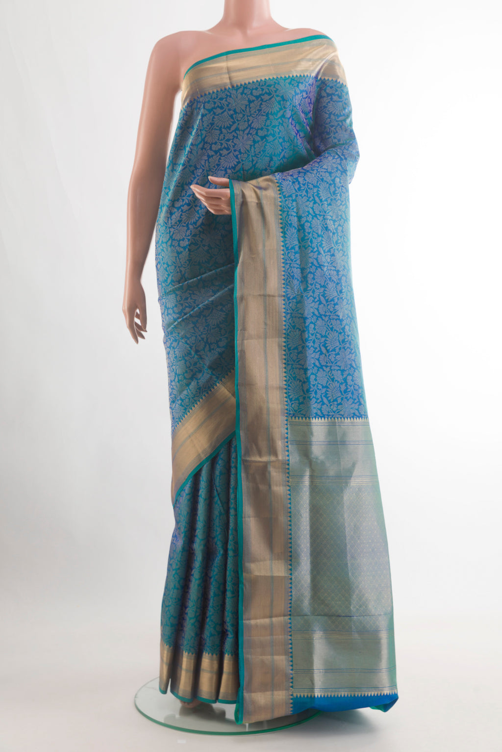 Peacock Blue Soft Silk Saree with Zari Brocade on the body and Zari Border.  displayed on a mannequin