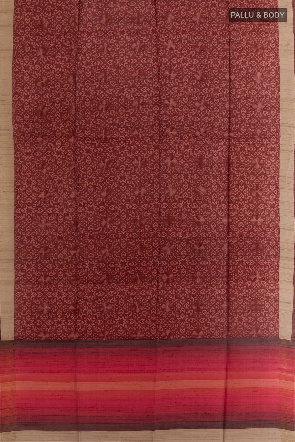 Flat view of Brown Tussar Silk Saree with Printed design on the body and Zari Border. 
