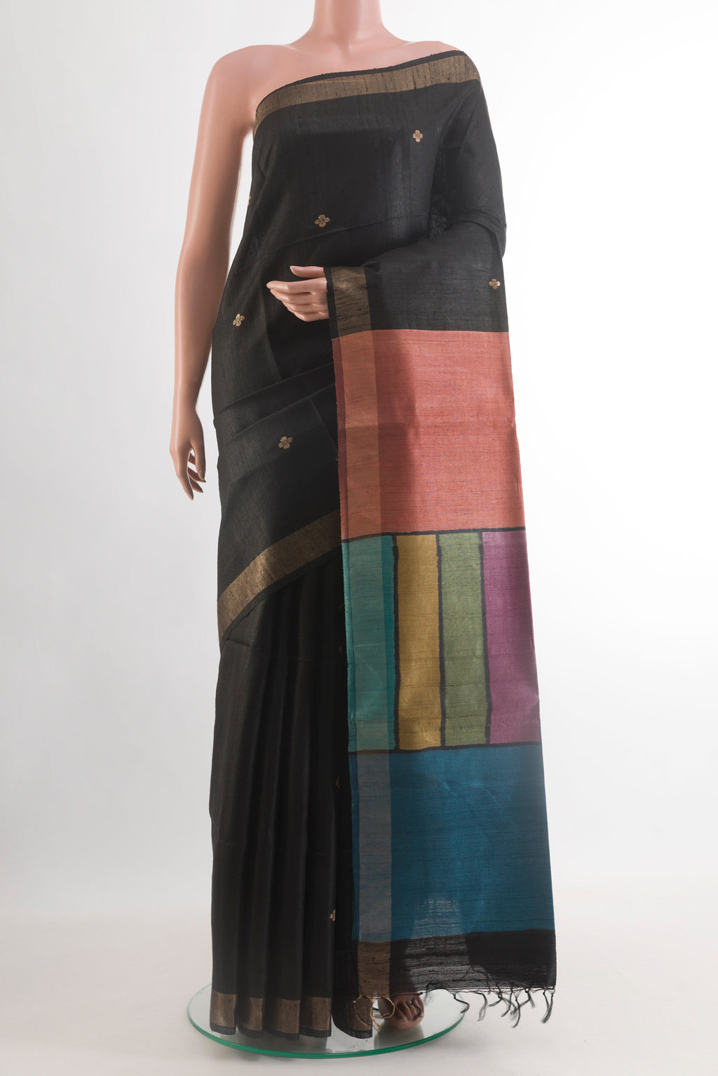 Black Tussar Silk Saree with Zari Butta on the body and Zari Border.  displayed on a mannequin