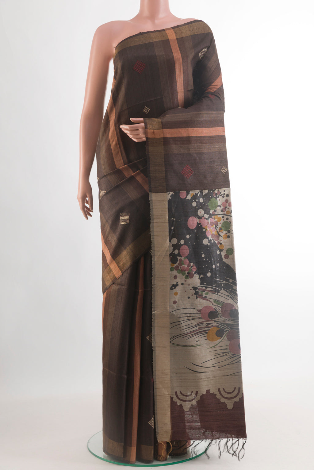 Brown Tussar Silk Saree with Stripes on the body and Zari Border.  displayed on a mannequin