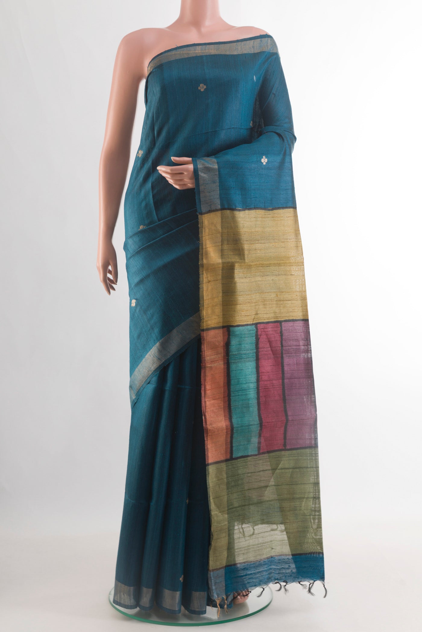 Blue Tussar Silk Saree with Zari Butta on the body and Zari Border.  displayed on a mannequin