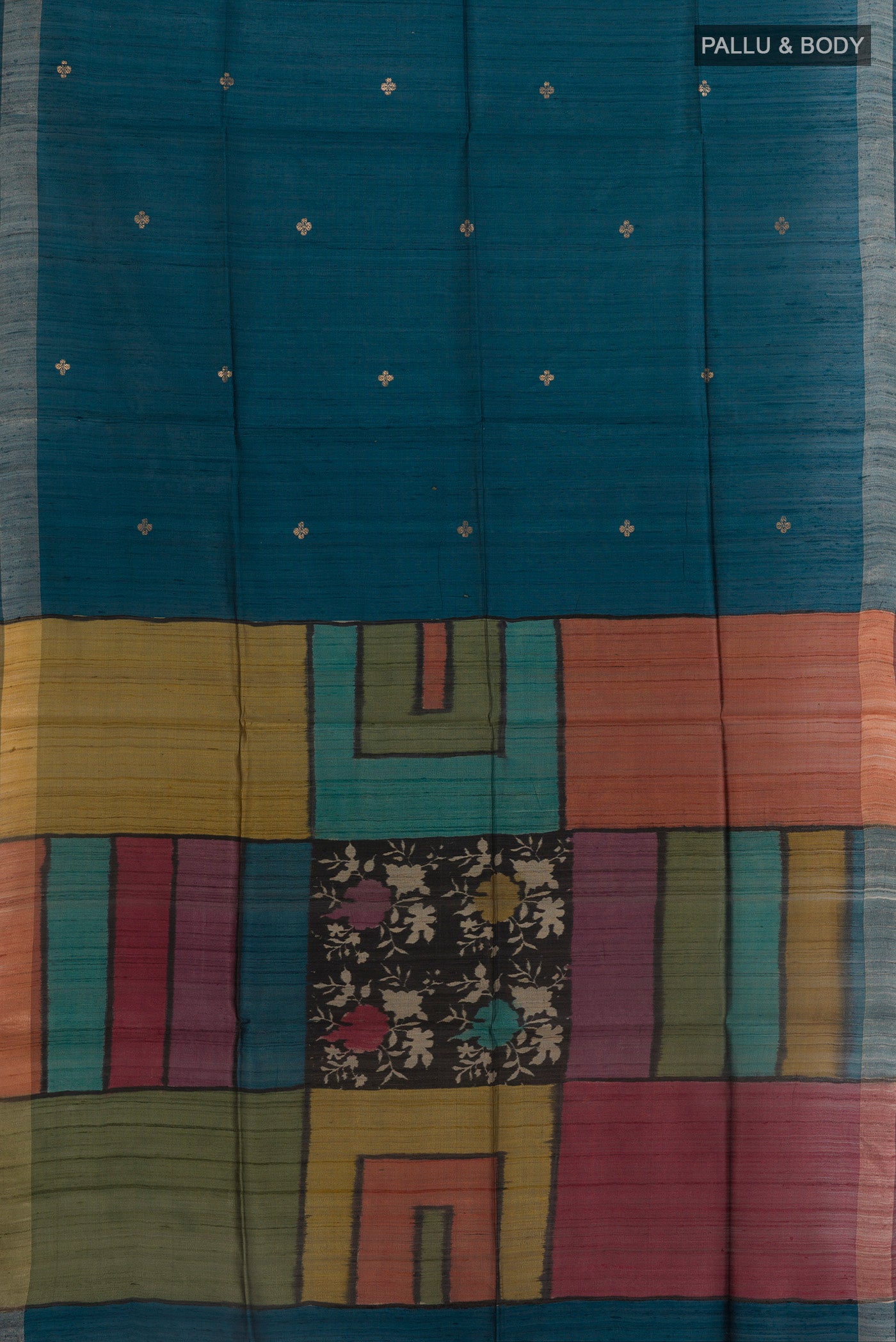 Flat view of Blue Tussar Silk Saree with Zari Butta on the body and Zari Border. 