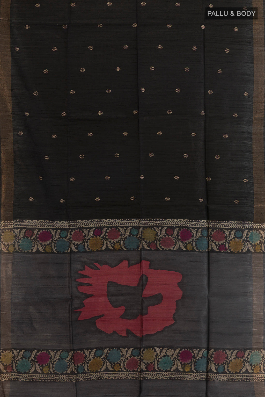 Flat view of Black Tussar Silk Saree with Thread Butta on the body and Zari Border. 