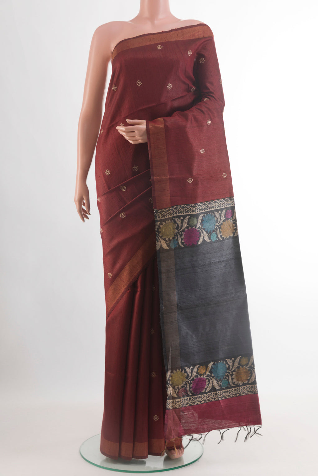 Brown Tussar Silk Saree with Thread Butta on the body and Zari Border.  displayed on a mannequin
