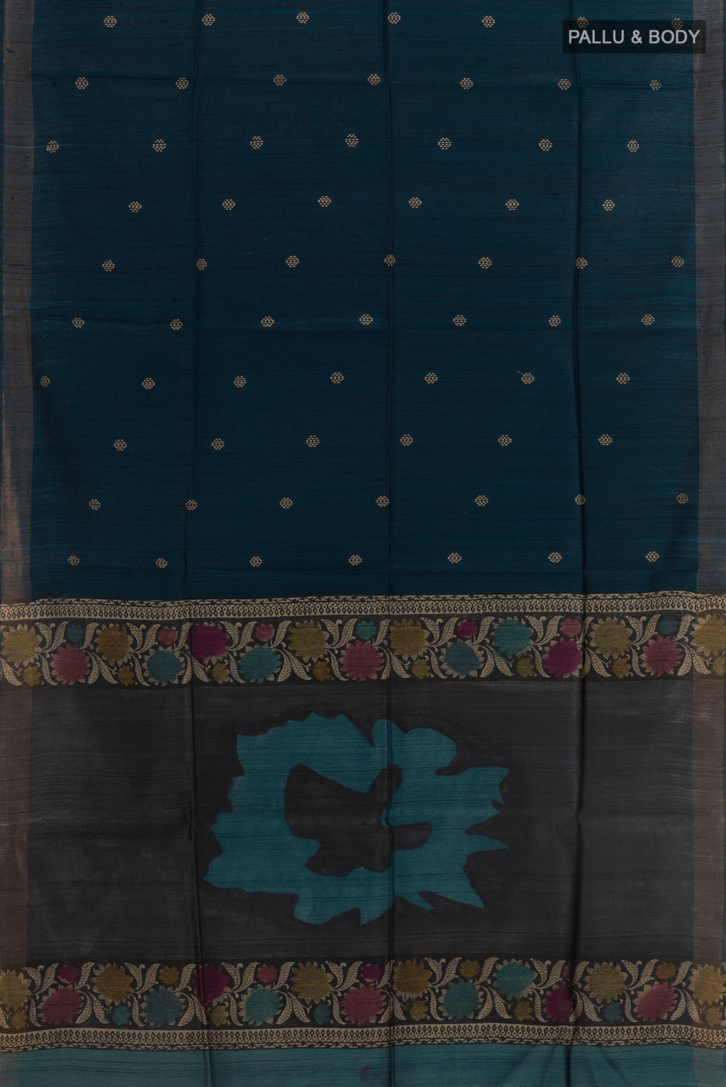 Flat view of Blue Tussar Silk Saree with Thread Butta on the body and Zari Border. 