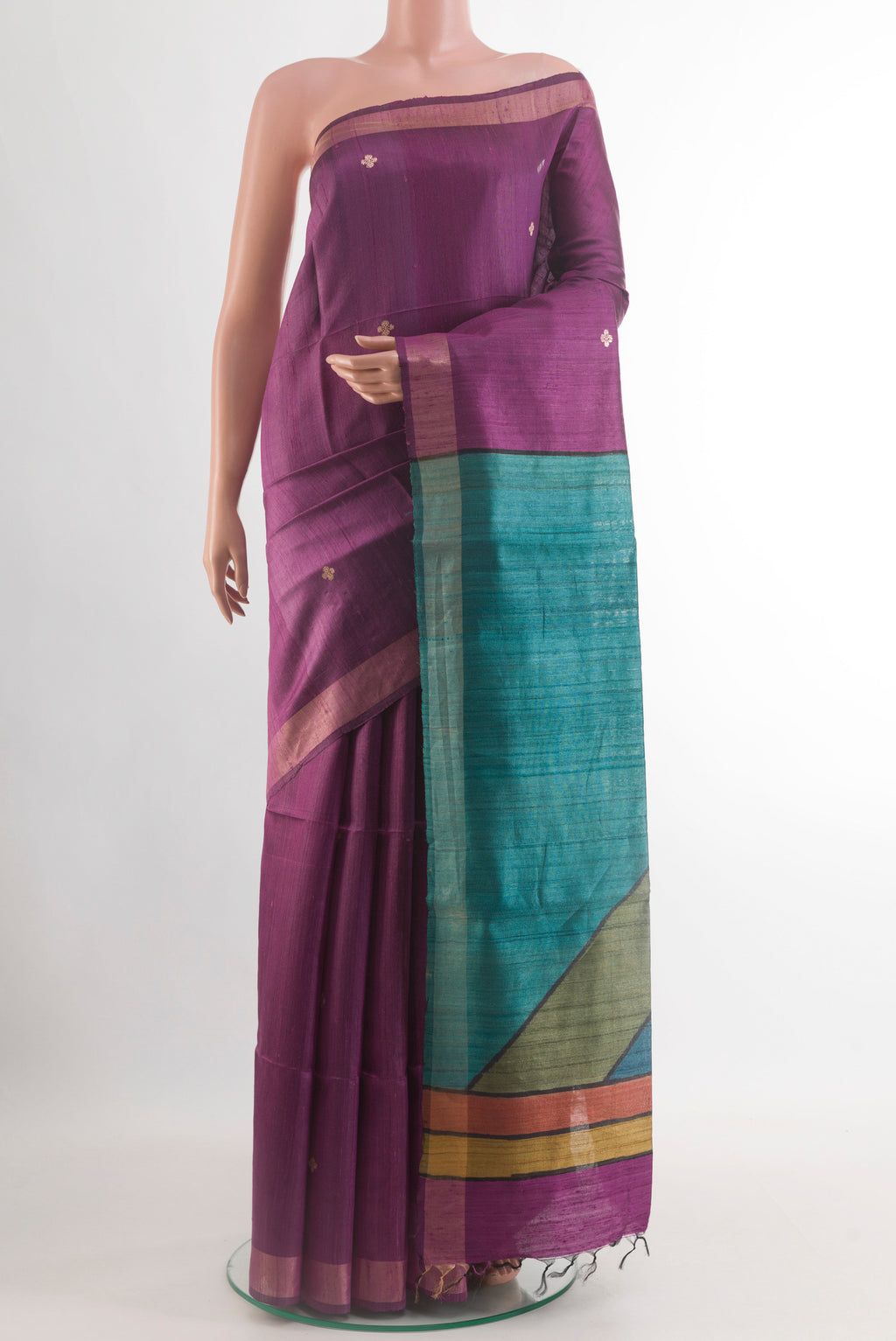 Purple Tussar Silk Saree with Zari Butta on the body and Zari Border.  displayed on a mannequin