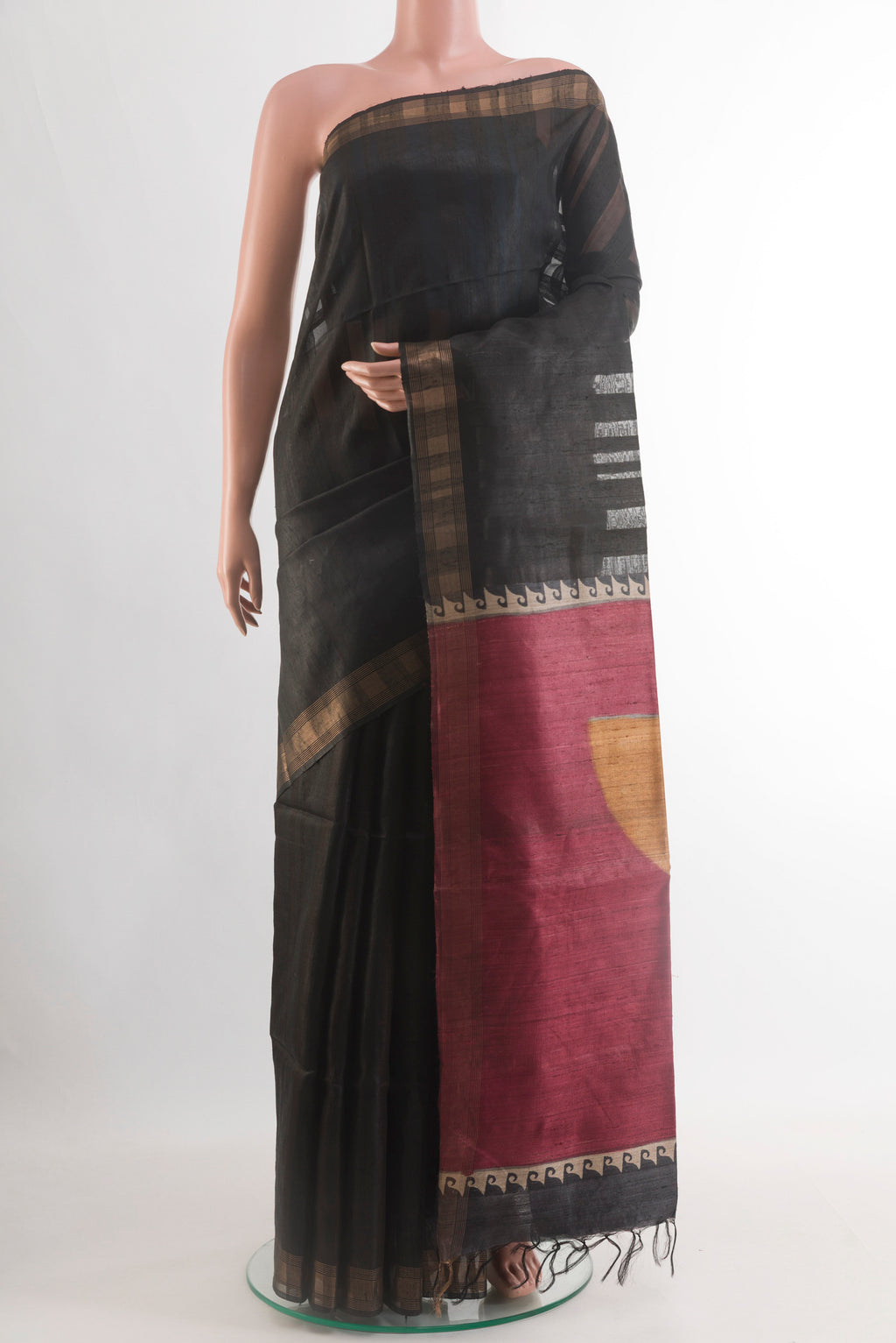 Black Tussar Silk Saree with Stripes on the body and Zari Border.  displayed on a mannequin