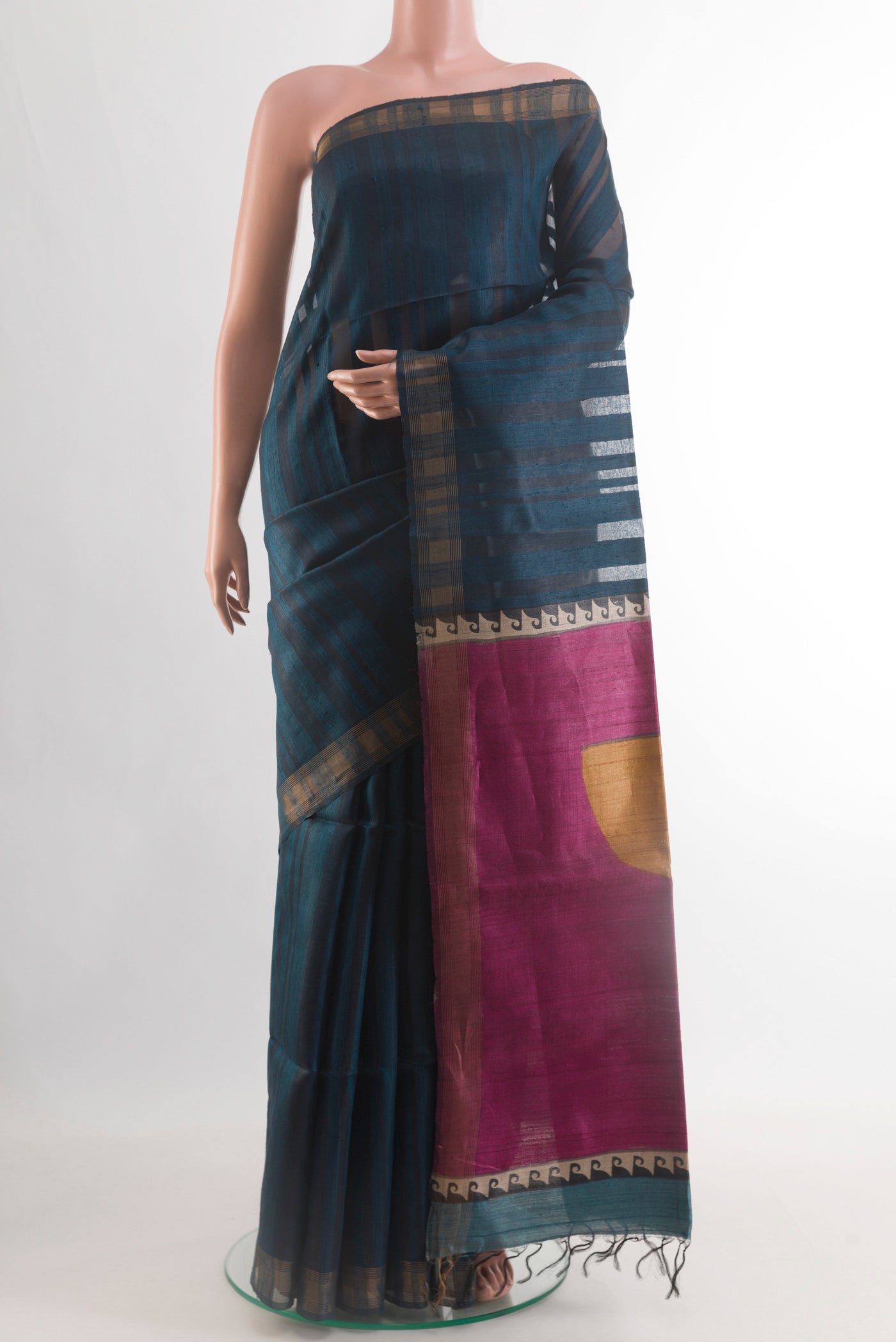 Blue Tussar Silk Saree with Stripes on the body and Zari Border.  displayed on a mannequin