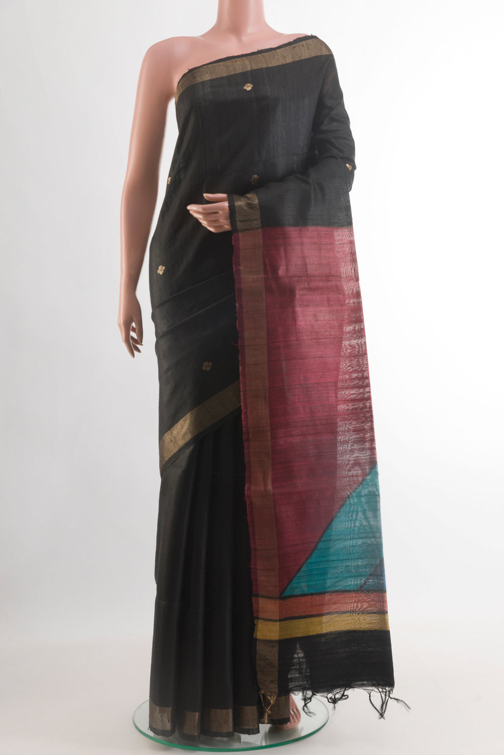Black Tussar Silk Saree with Zari Butta on the body and Zari Border.  displayed on a mannequin