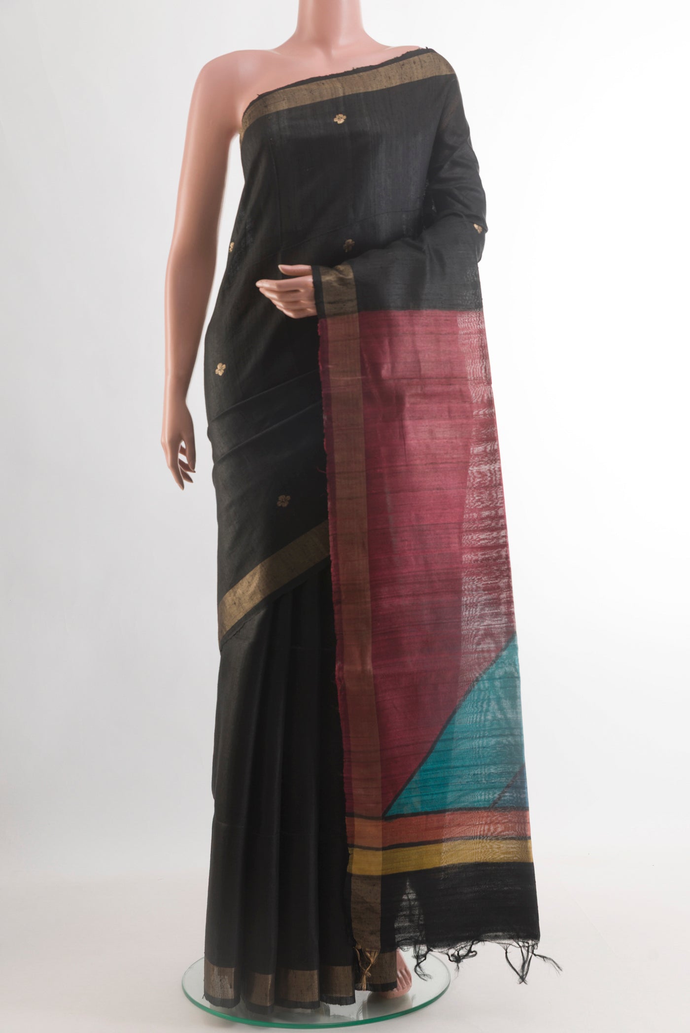 Black Tussar Silk Saree with Zari Butta on the body and Zari Border.  displayed on a mannequin