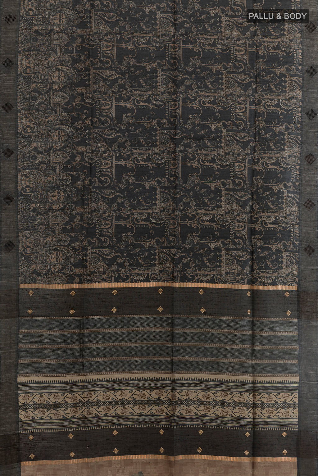 Flat view of Black Tussar Silk Saree with Printed design on the body and Zari Border. 