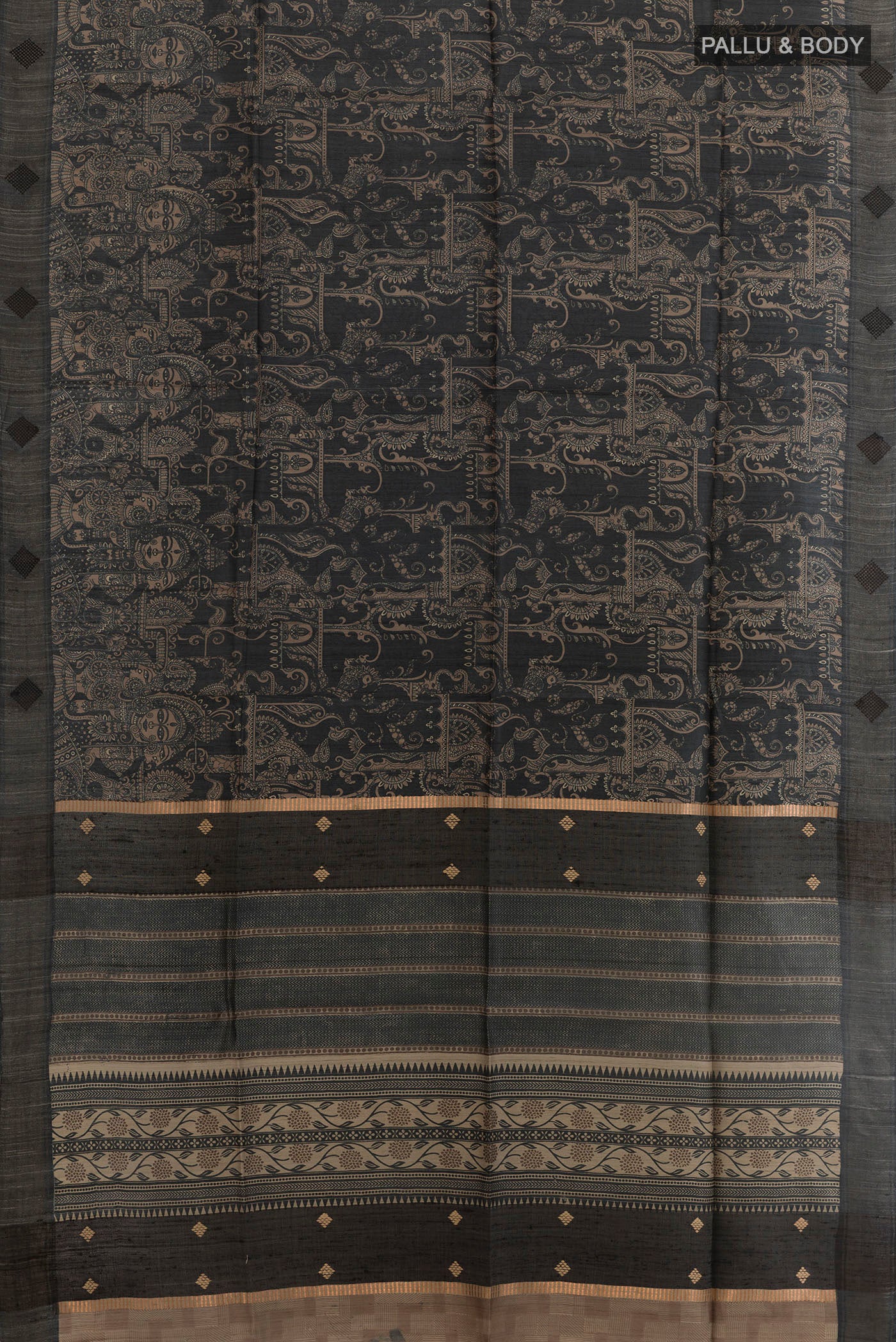 Flat view of Black Tussar Silk Saree with Printed design on the body and Zari Border. 
