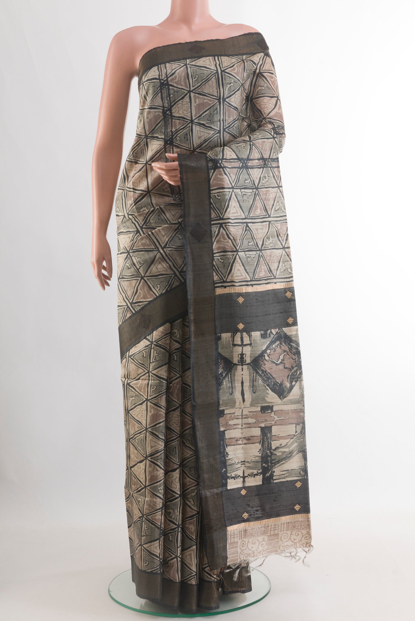 Beige Tussar Silk Saree with Printed design on the body and Zari Border.  displayed on a mannequin