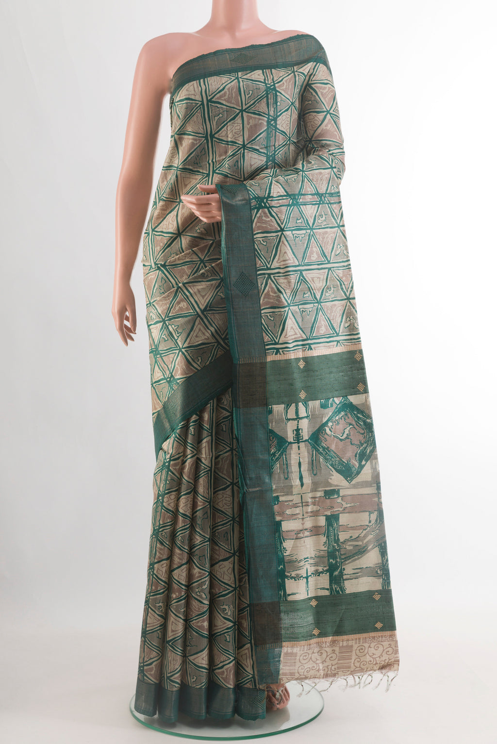 Beige Tussar Silk Saree with Printed design on the body and Zari Border.  displayed on a mannequin