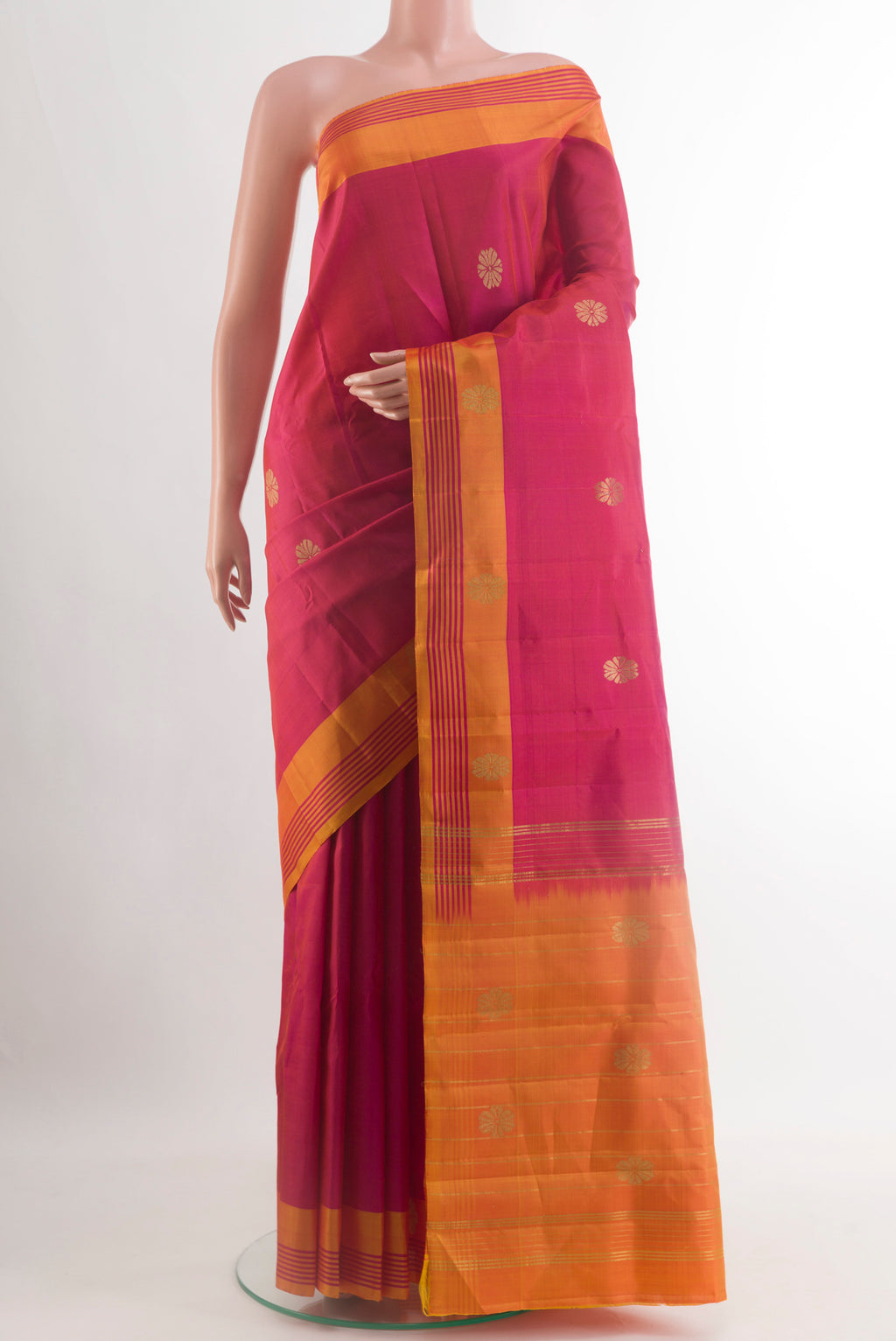Pink Kanchipuram Silk Saree with Zari Butta on the body and Plain Border.  displayed on a mannequin