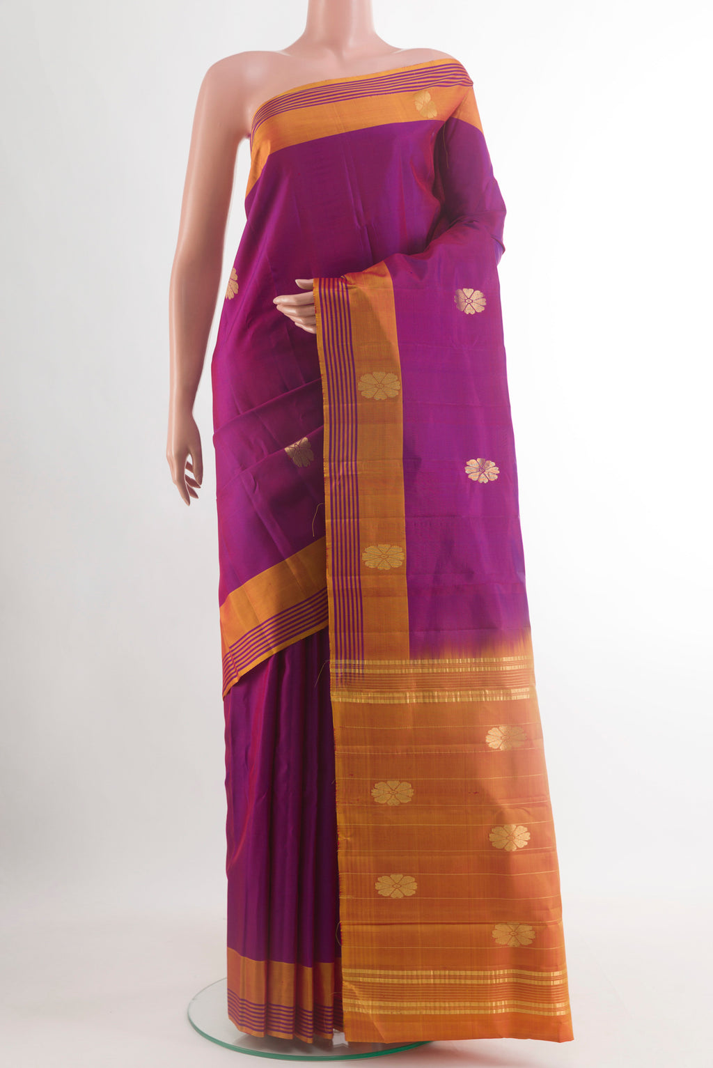 Purple Kanchipuram Silk Saree with Zari Butta on the body and Plain Border.  displayed on a mannequin