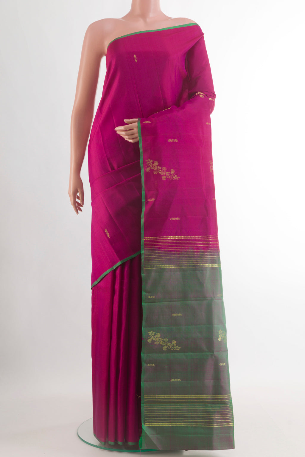 Magenta Kanchipuram Silk Saree with Zari Butta on the body and Plain Border.  displayed on a mannequin