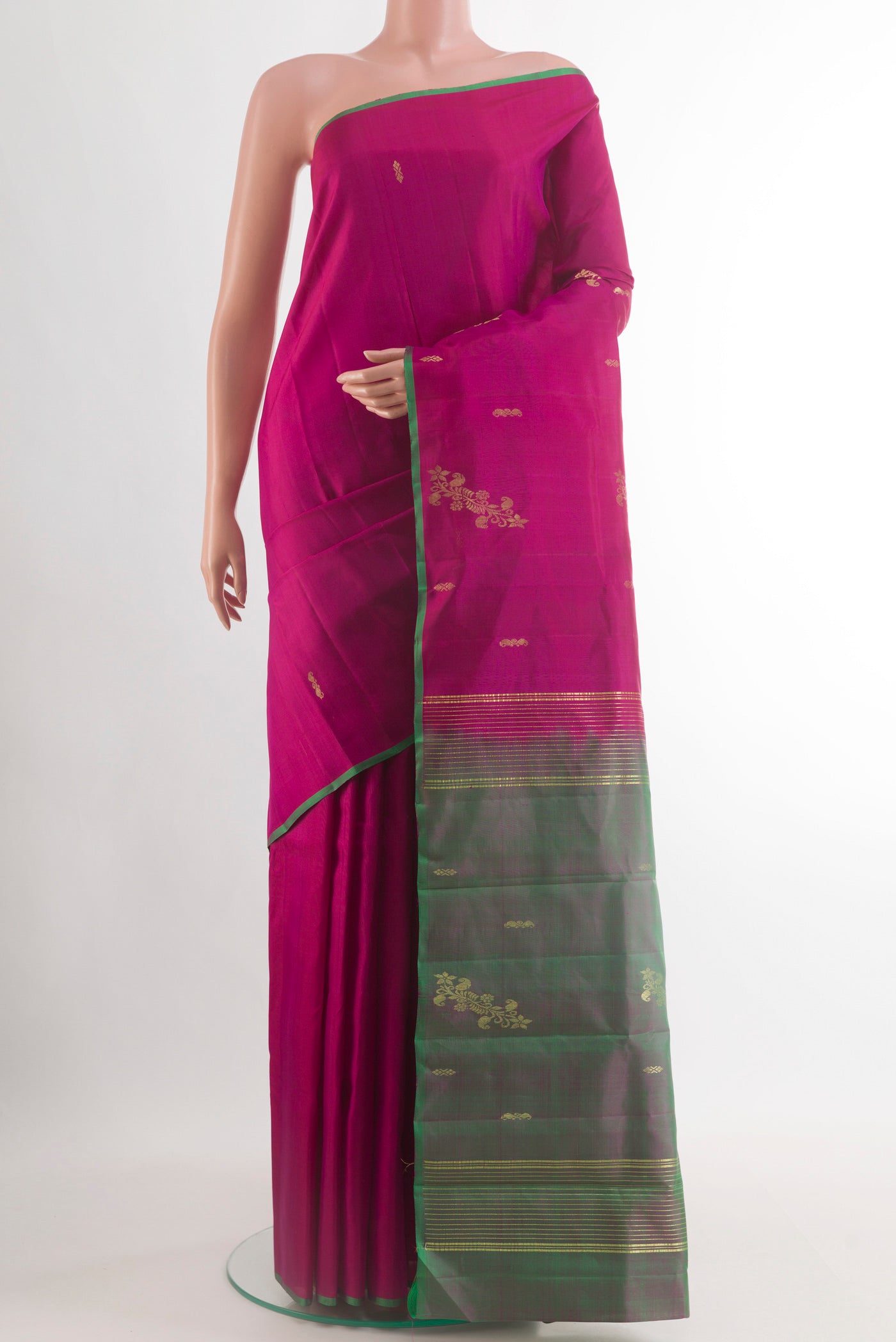 Magenta Kanchipuram Silk Saree with Zari Butta on the body and Plain Border.  displayed on a mannequin